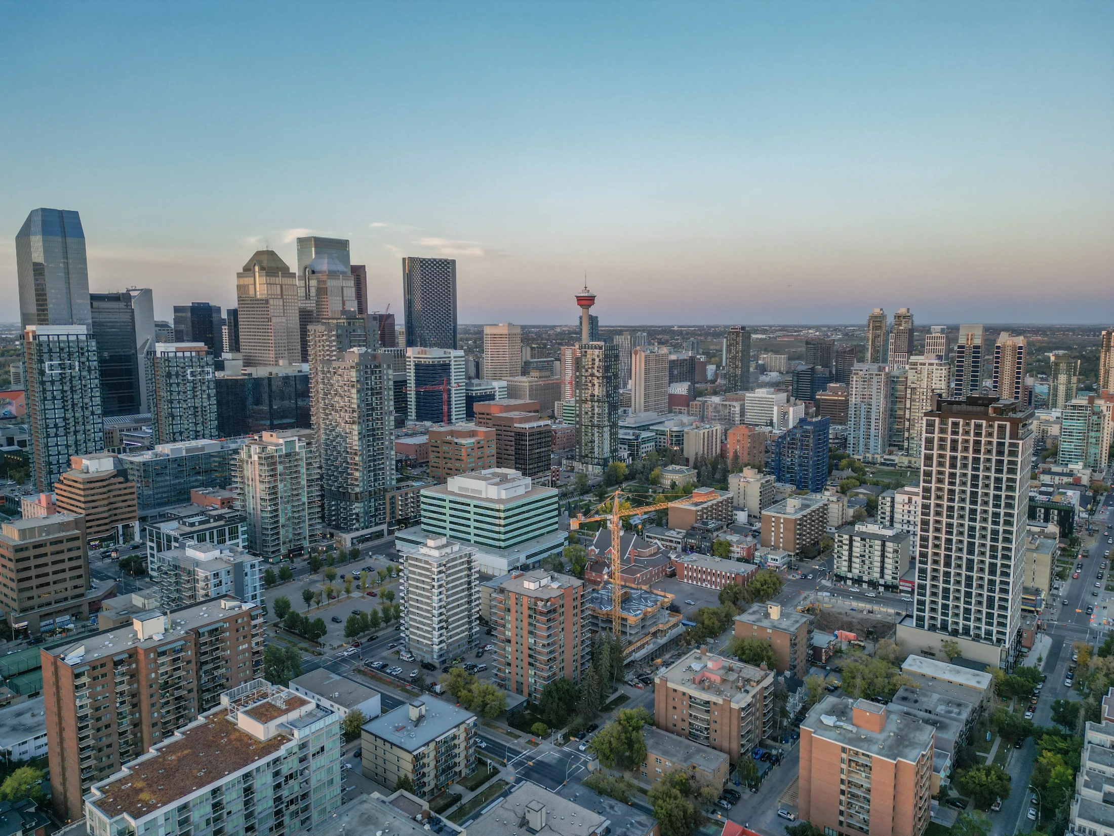 Aerial of inner-city condo towers with the Calgary Tower in view