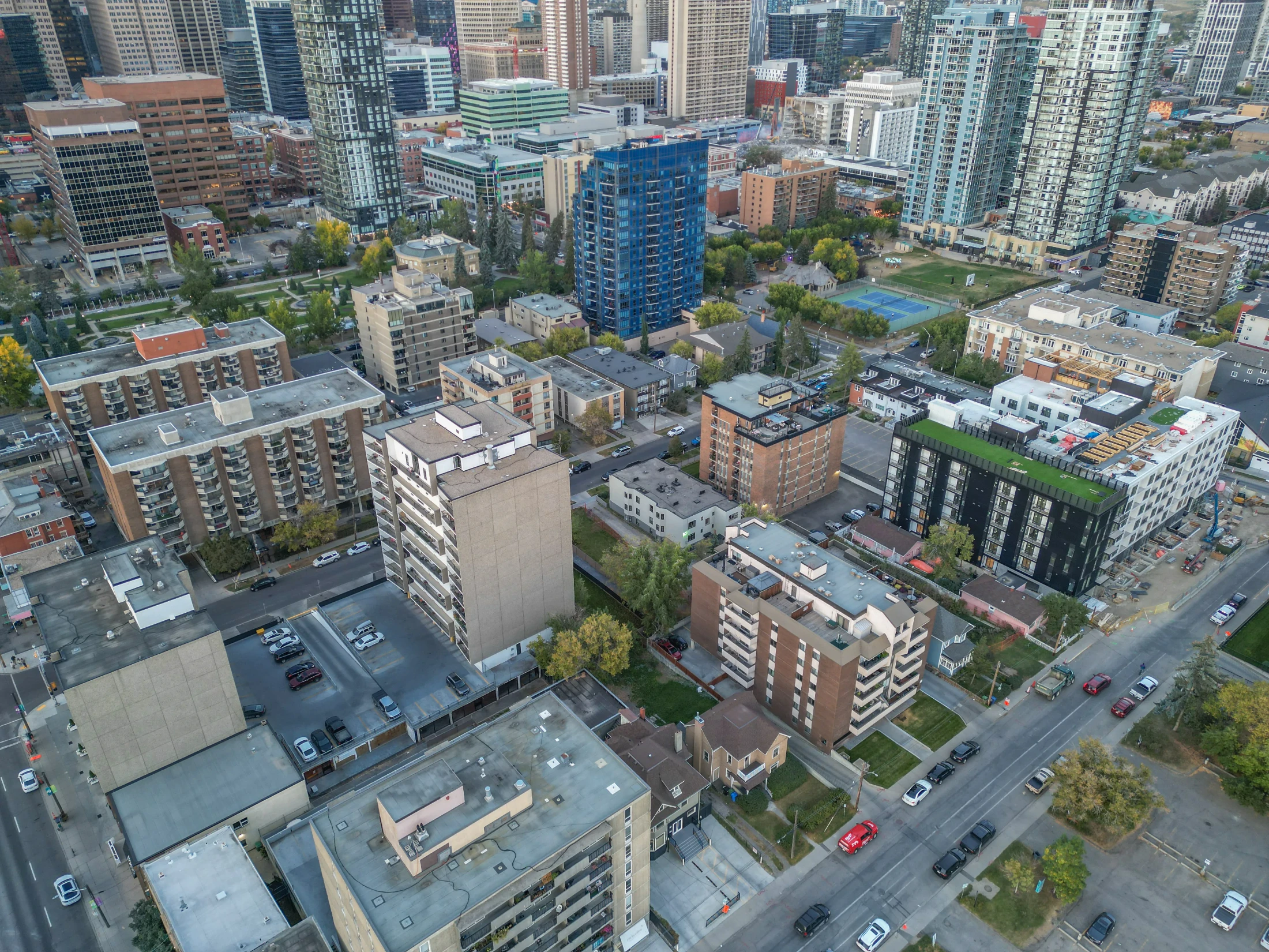 Aerial of mid-rise condo buildings and parking near downtown