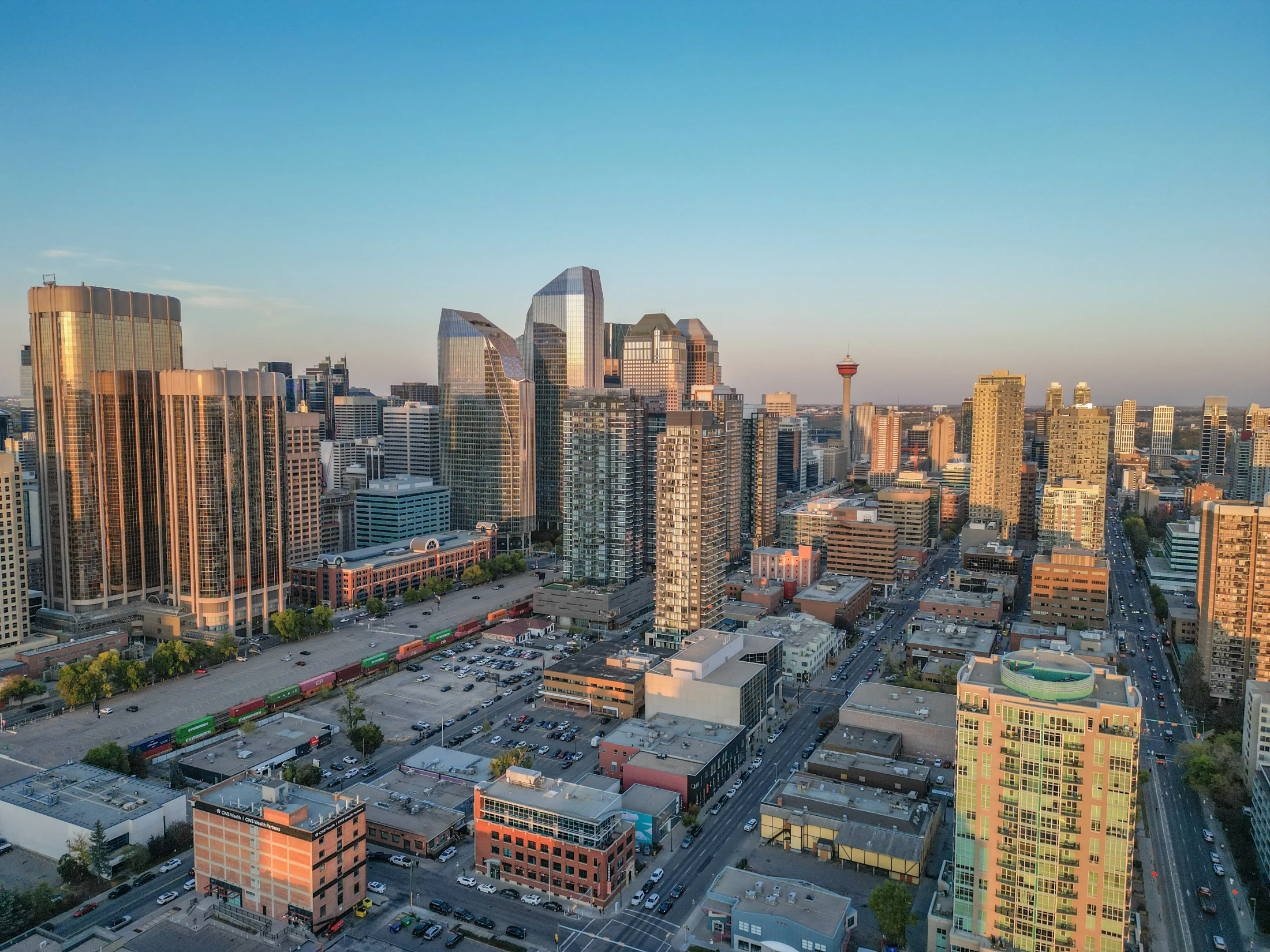 Aerial of downtown condo towers and lower buildings at golden hour