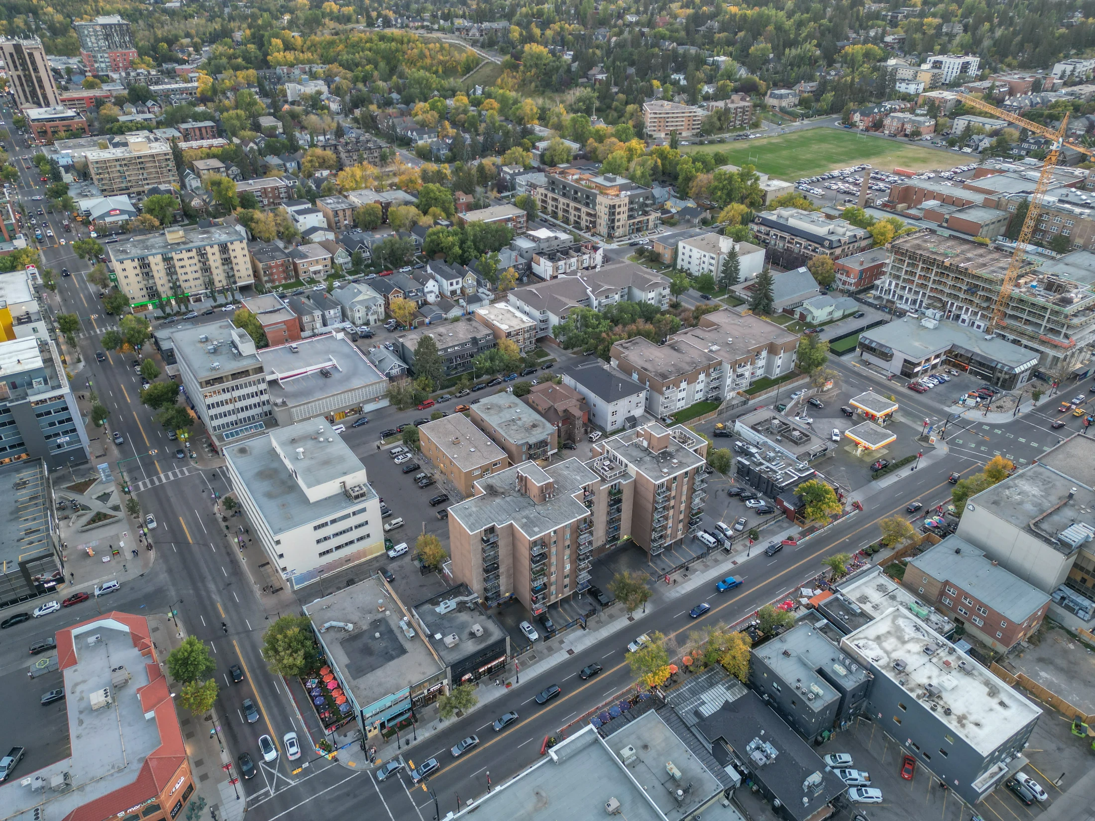 Aerial of low-rise apartments and houses on a grid of streets