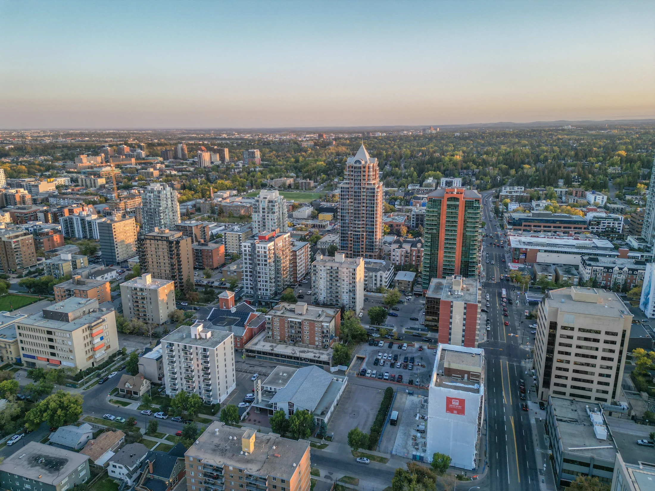 Aerial of an inner-city neighbourhood of apartments and mature trees