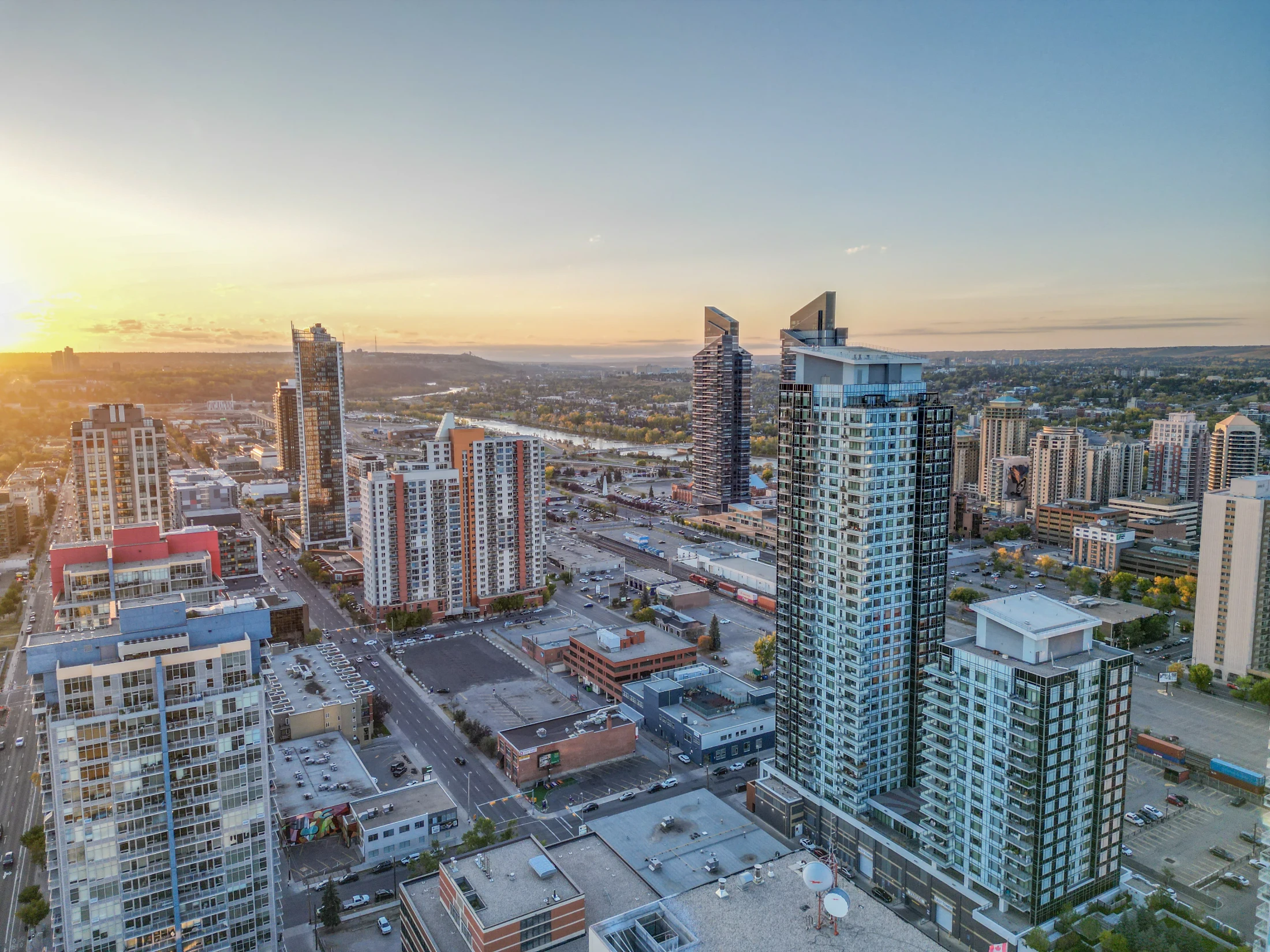 Condo towers at sunset with the downtown skyline