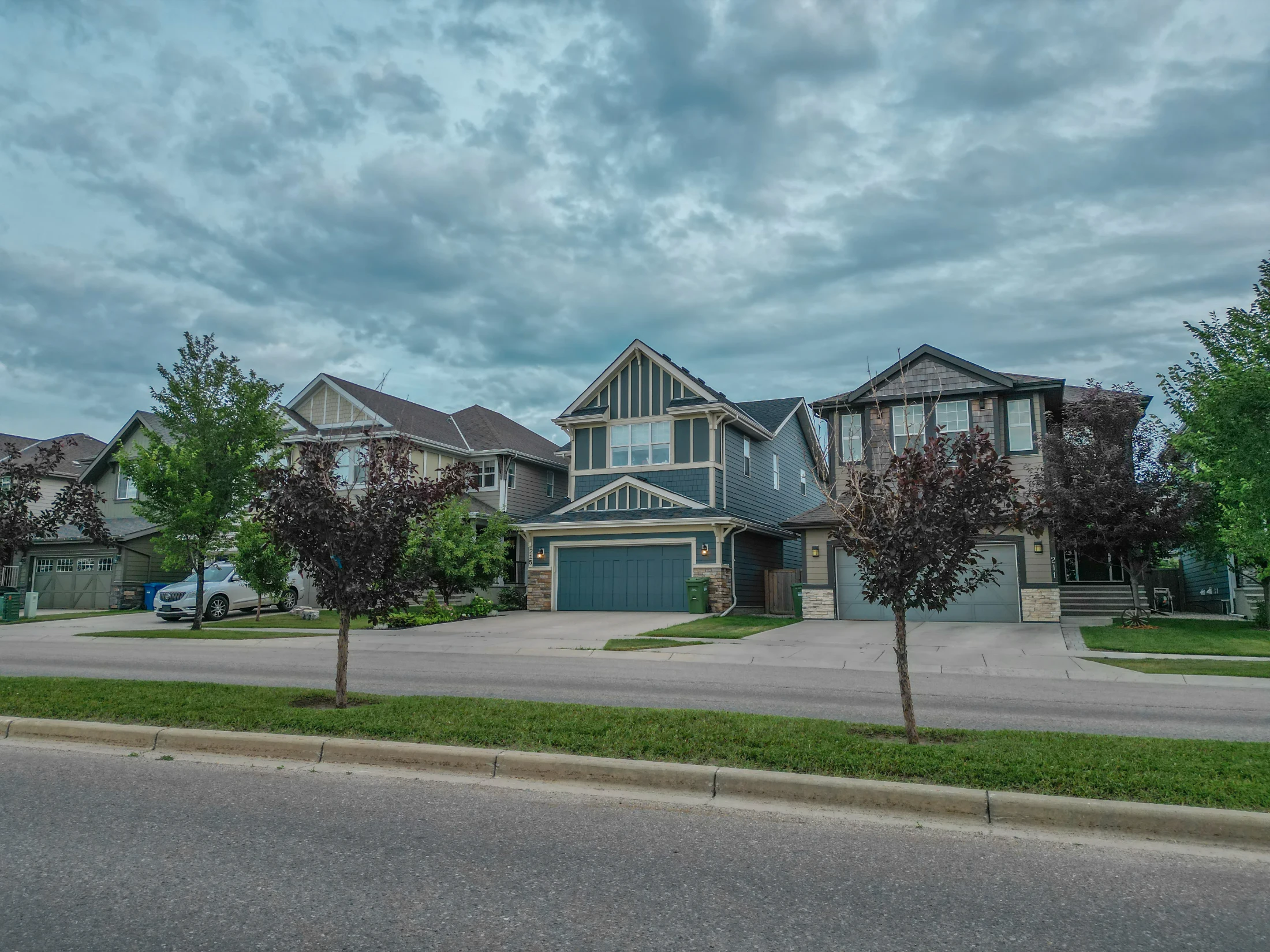 Two-storey homes and a grassy boulevard in north Calgary