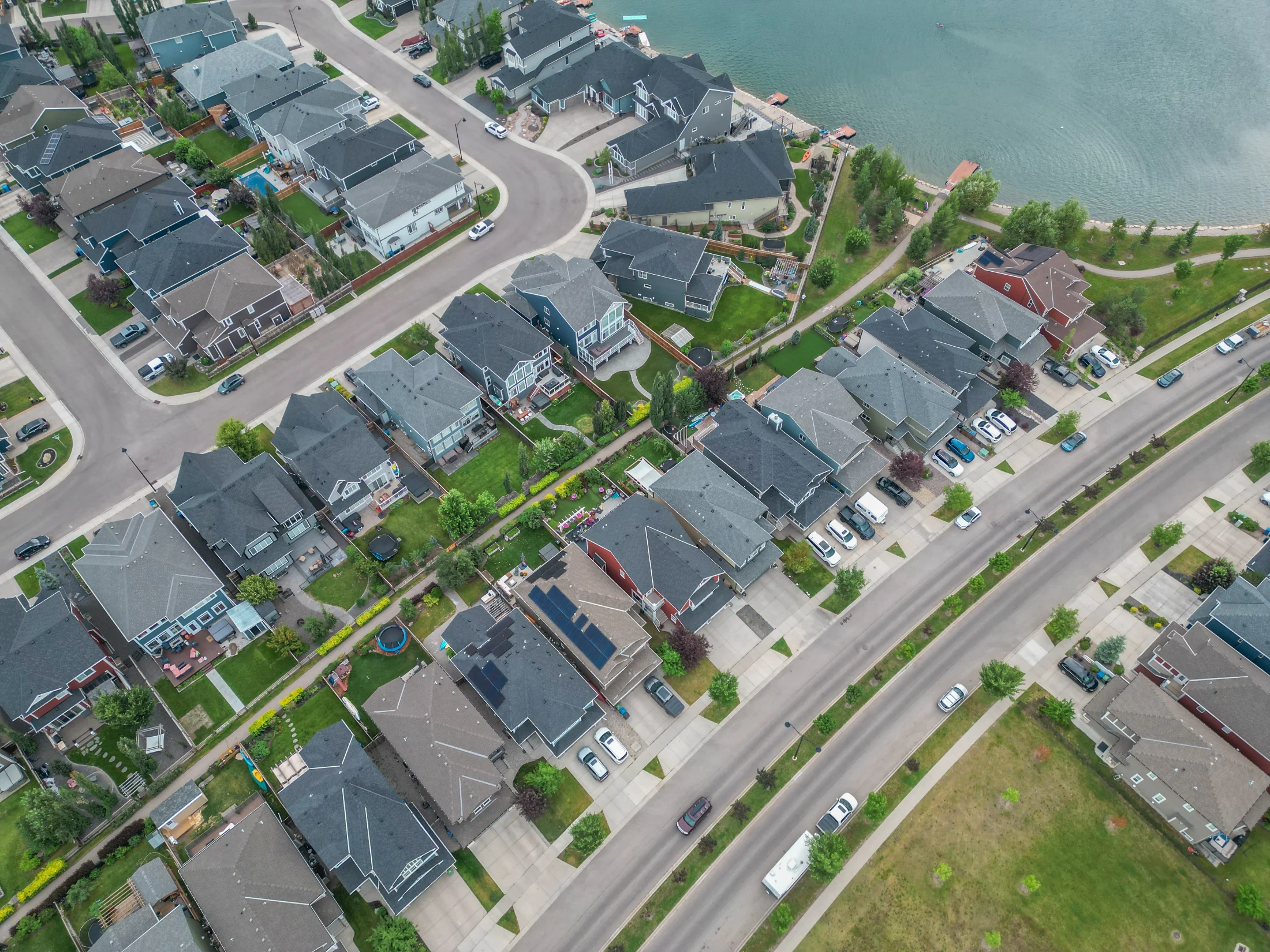 Two-storey detached homes with garages on a residential street in Calgary