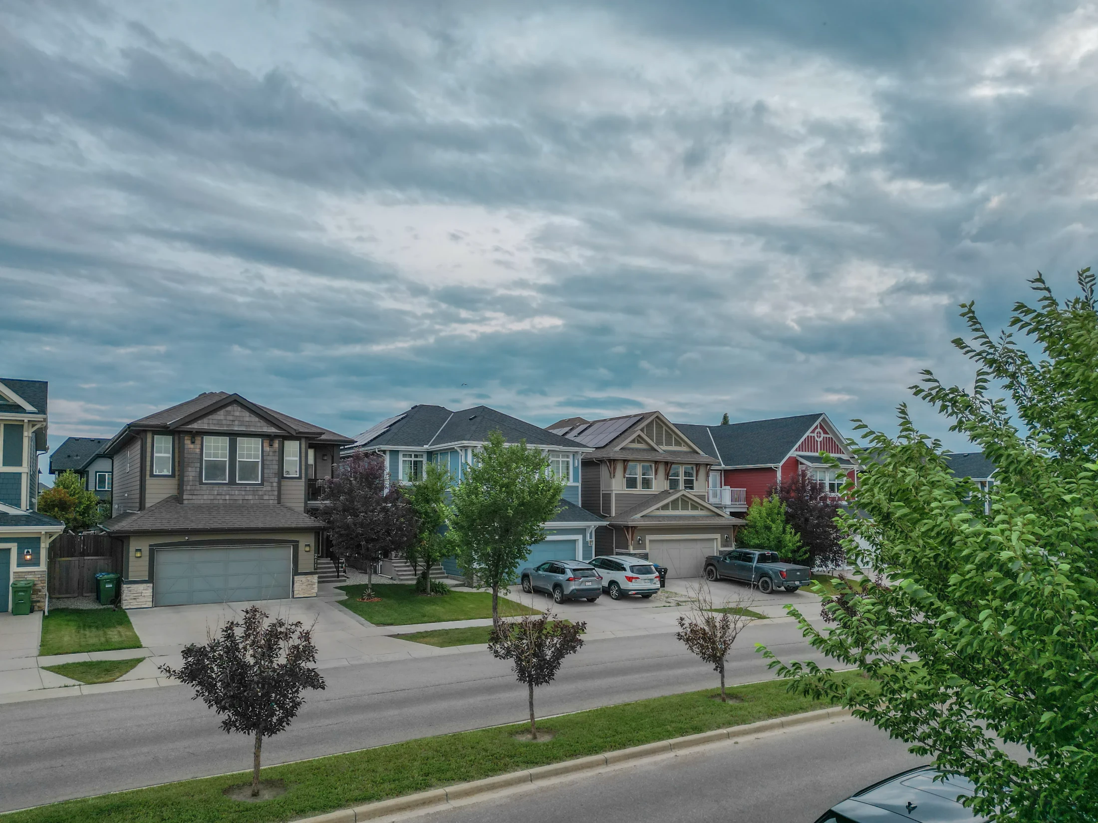 A family home with a front garage and landscaped yard in northwest Calgary