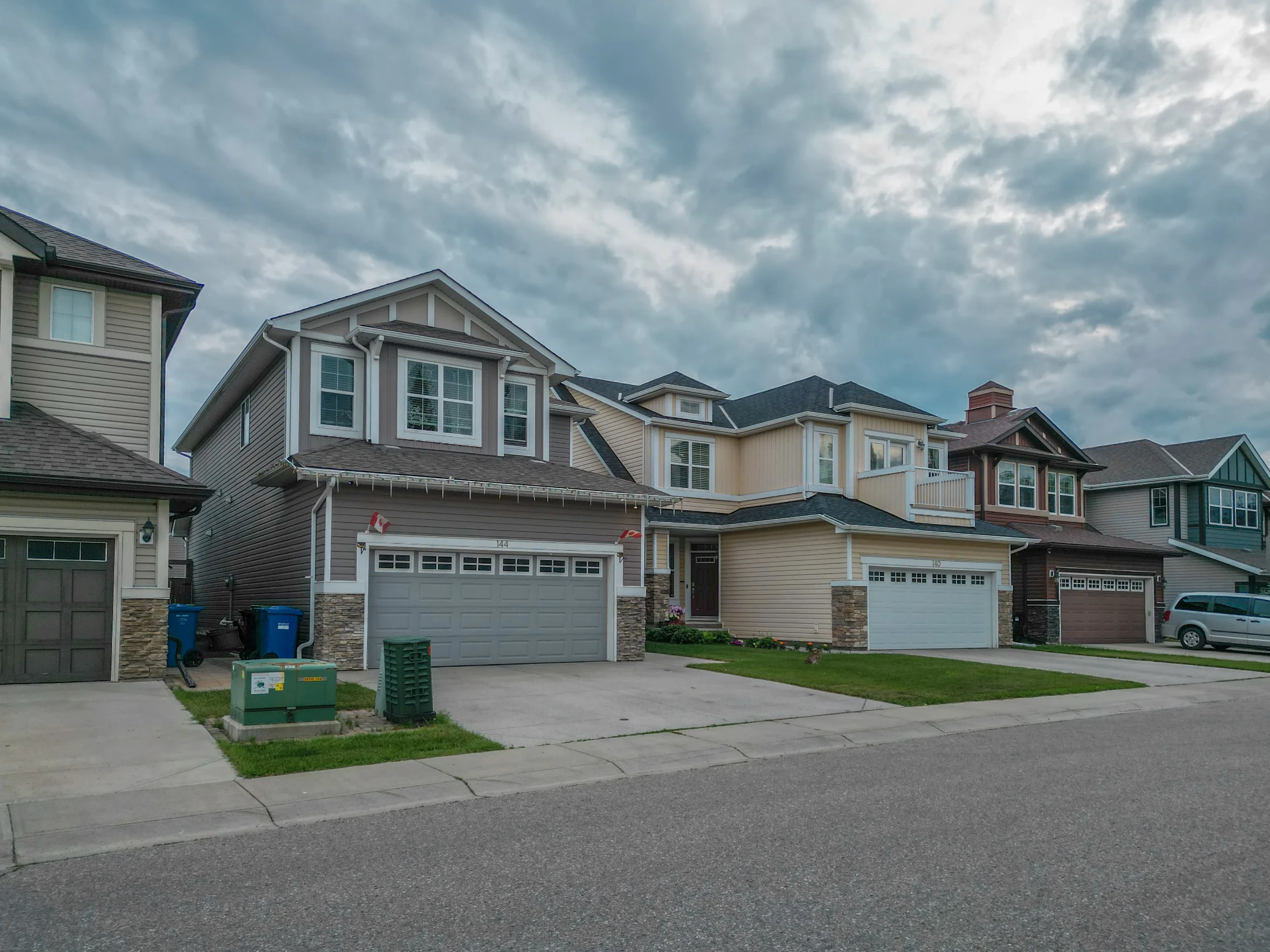 Two-storey homes with double front garages on a north Calgary street