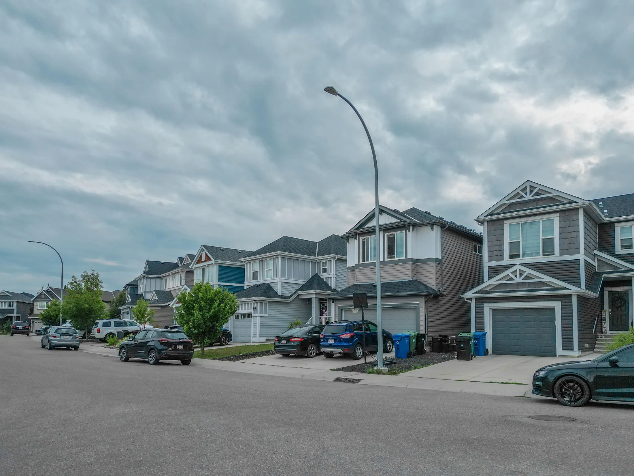 Detached homes with front garages on a quiet north Calgary street