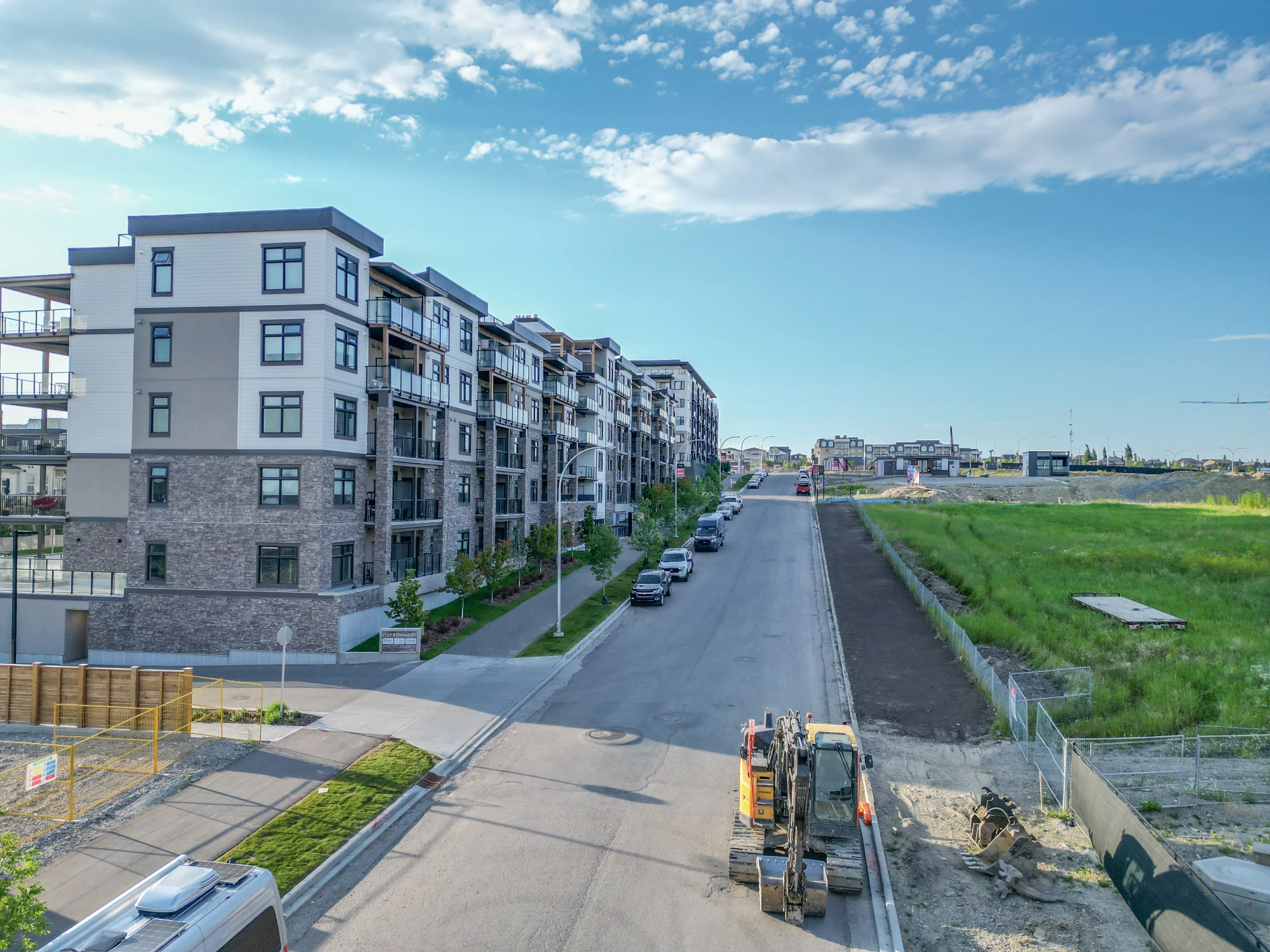 New low-rise condo building beside an open green space