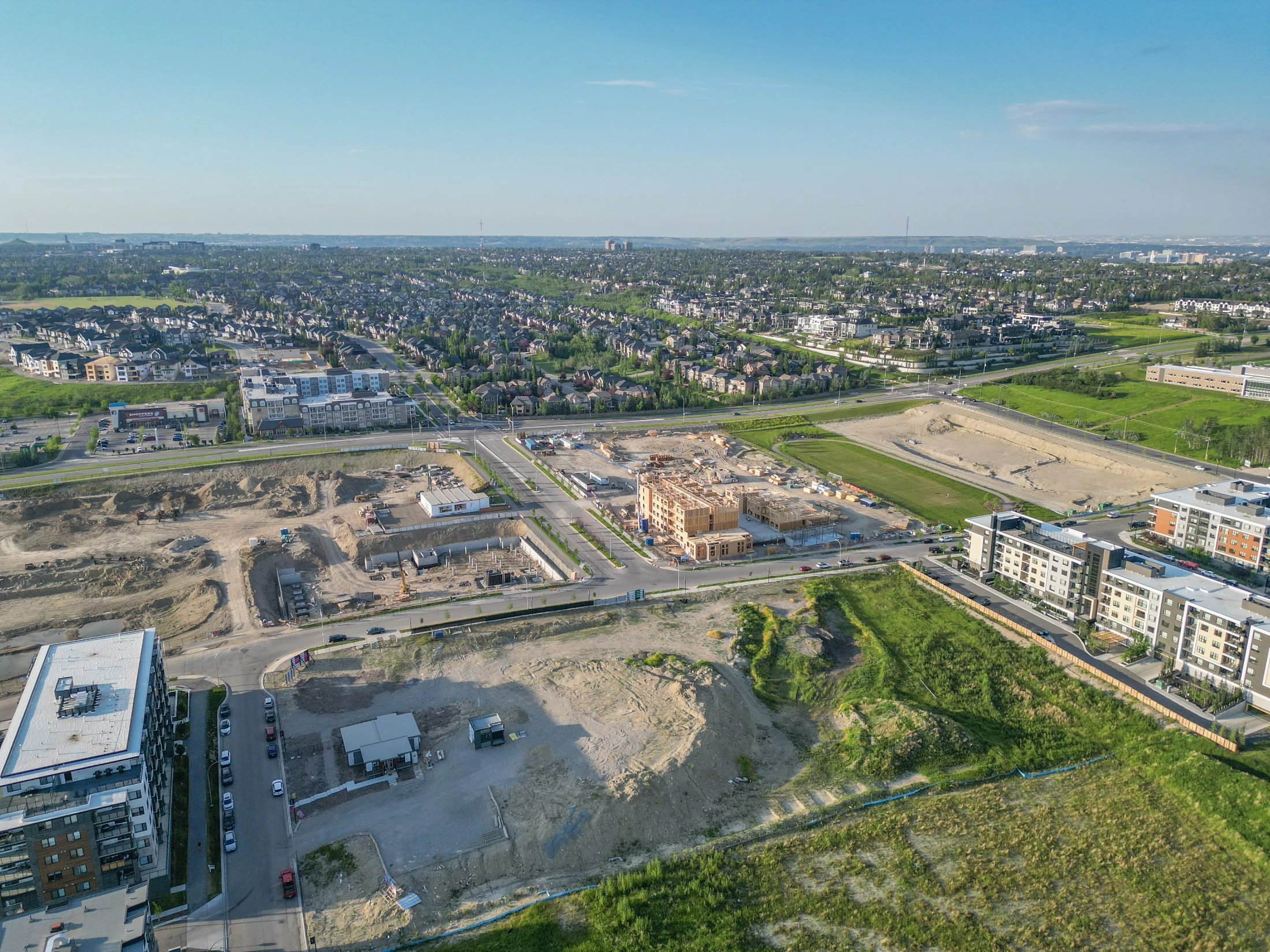 Aerial of new townhome rows under construction on a hillside