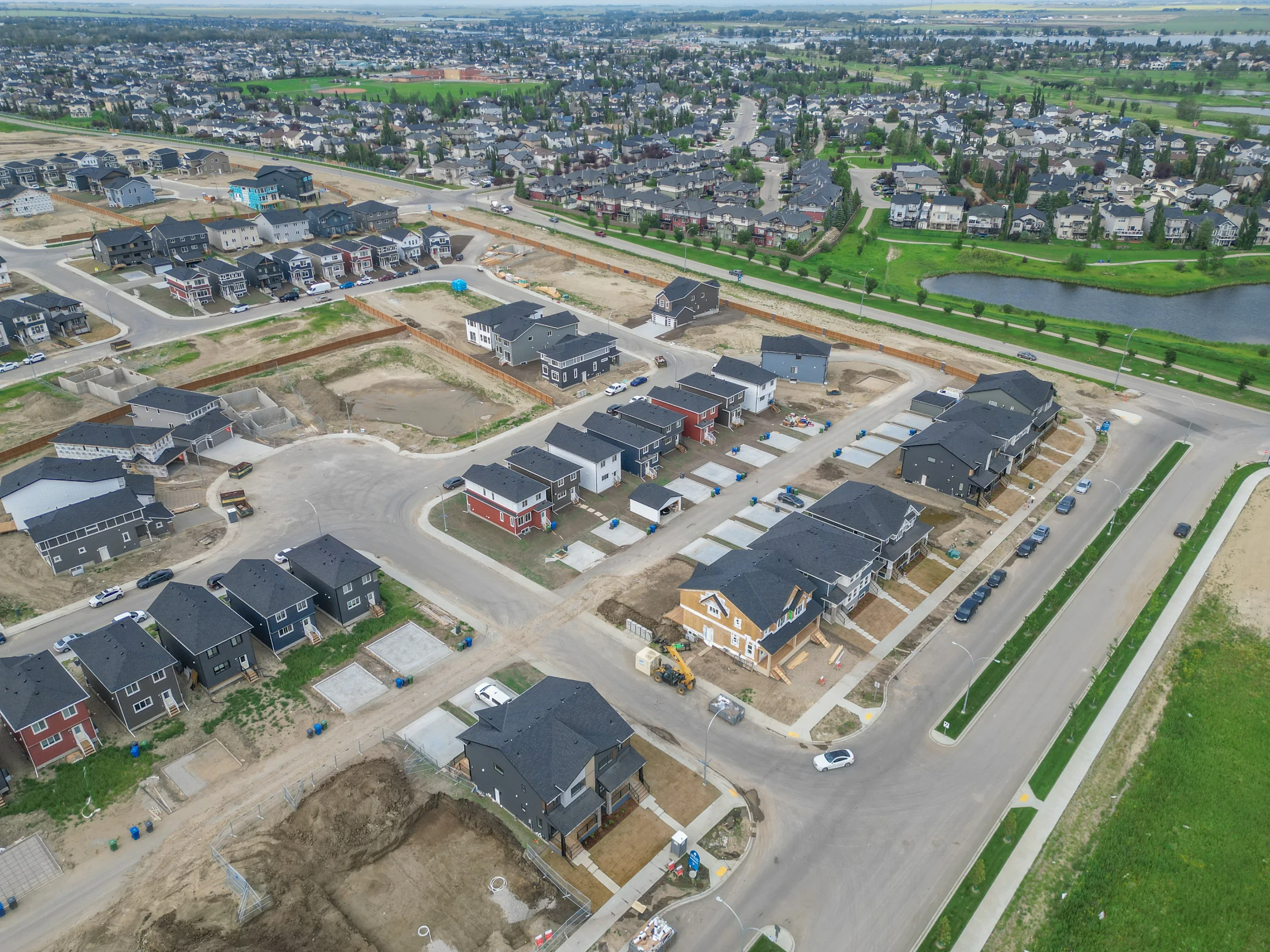 Aerial view of new homes under construction in Bridgeport, Chestermere, Alberta