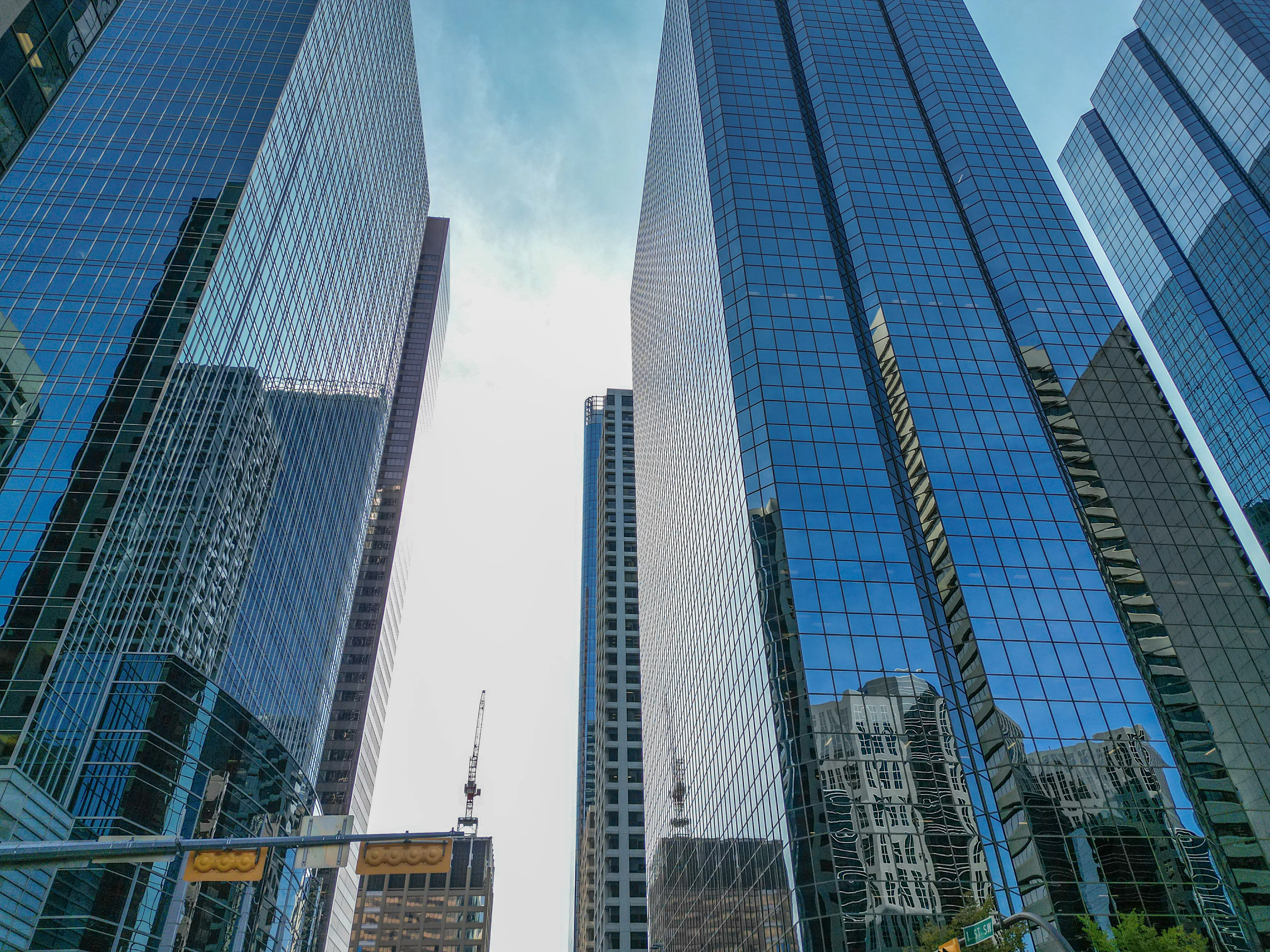 Looking up at glass office towers in downtown Calgary