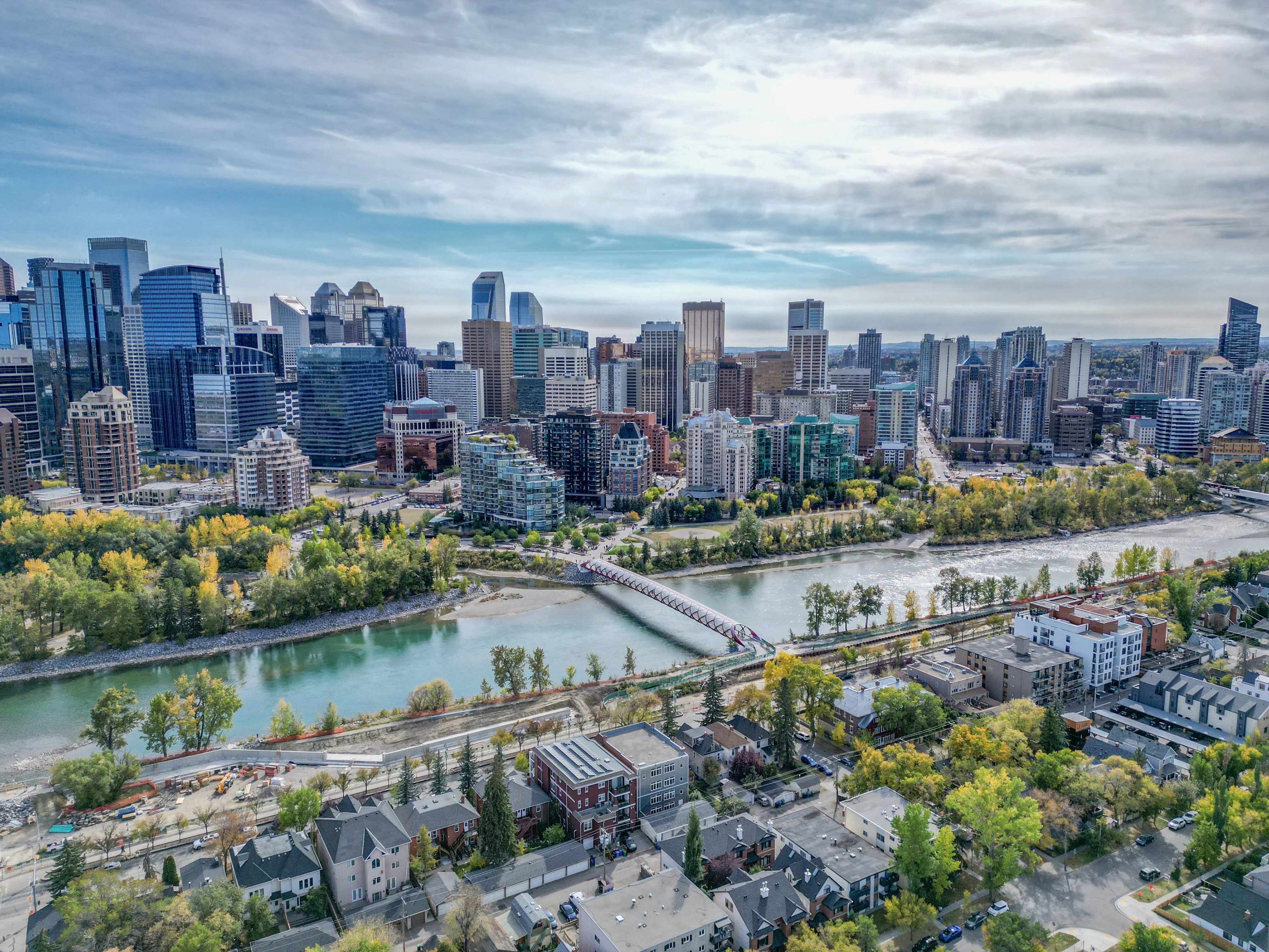Bow River with riverside pathways and parkland near downtown