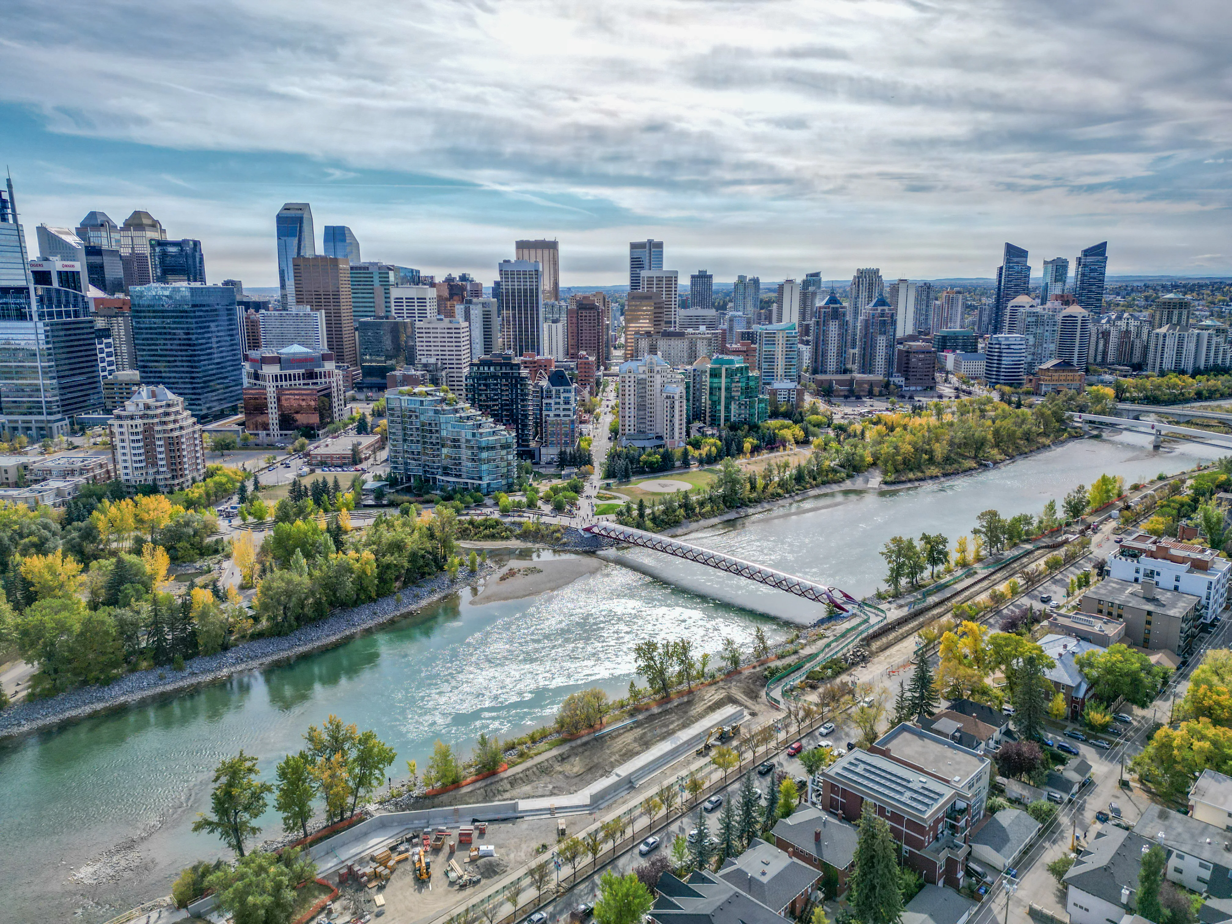 Bow River winding past riverside parkland and inner-city homes