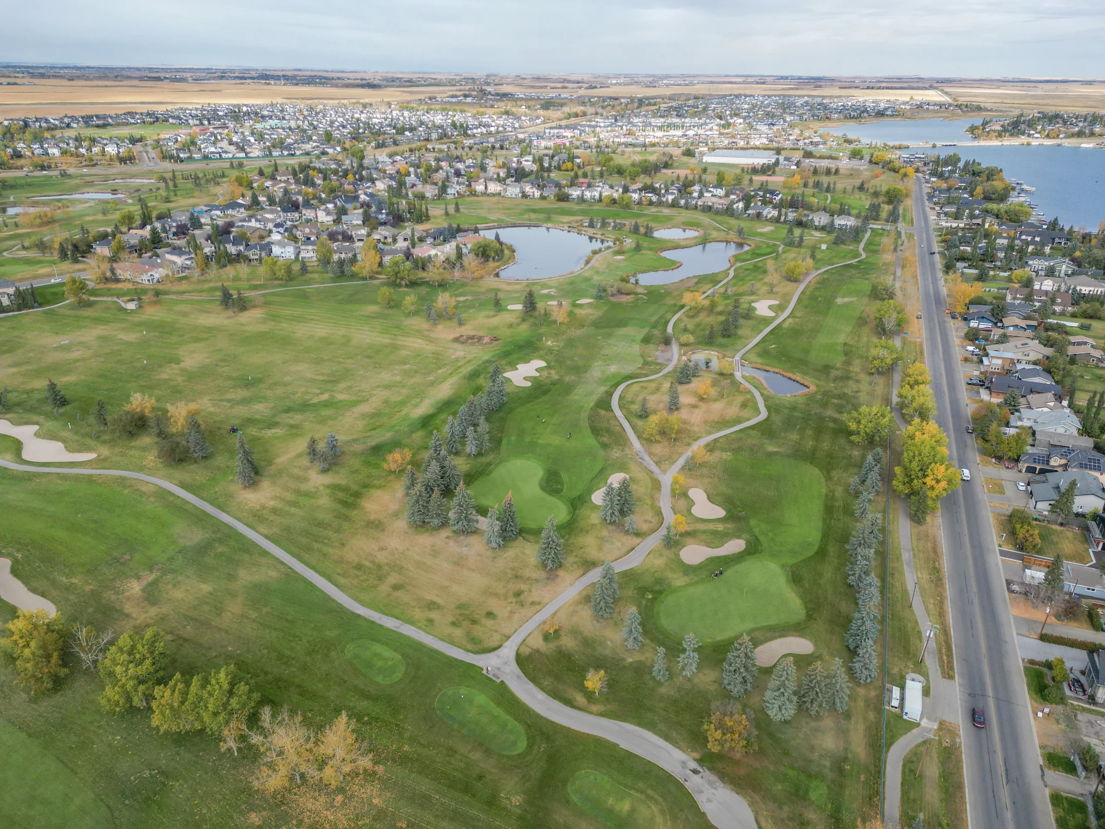 Golf course fairways and Chestermere Lake shoreline, Chestermere, Alberta
