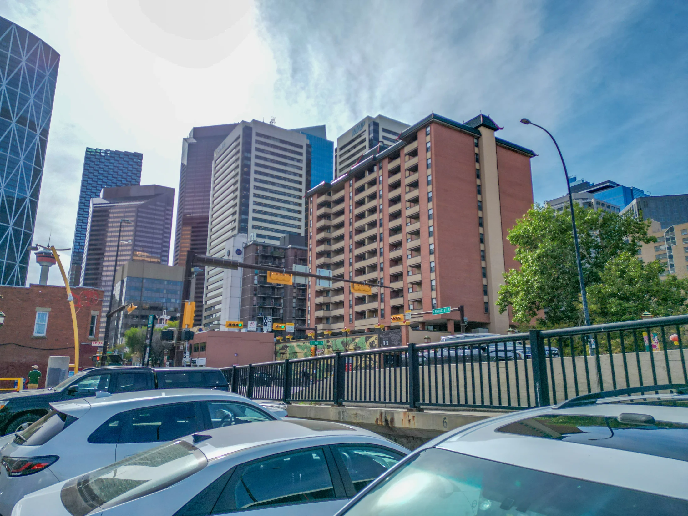 Calgary's Chinatown street with a brick apartment building and office towers