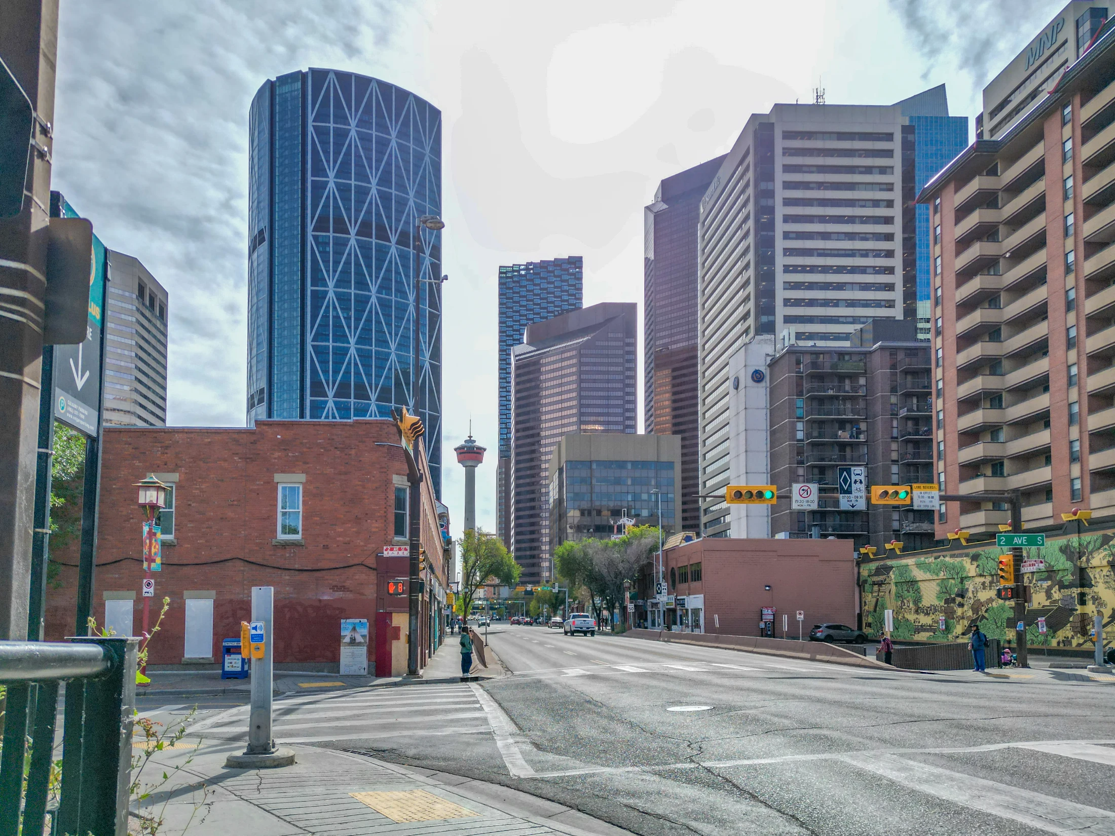 Chinatown street corner in Calgary with shops and downtown high-rises