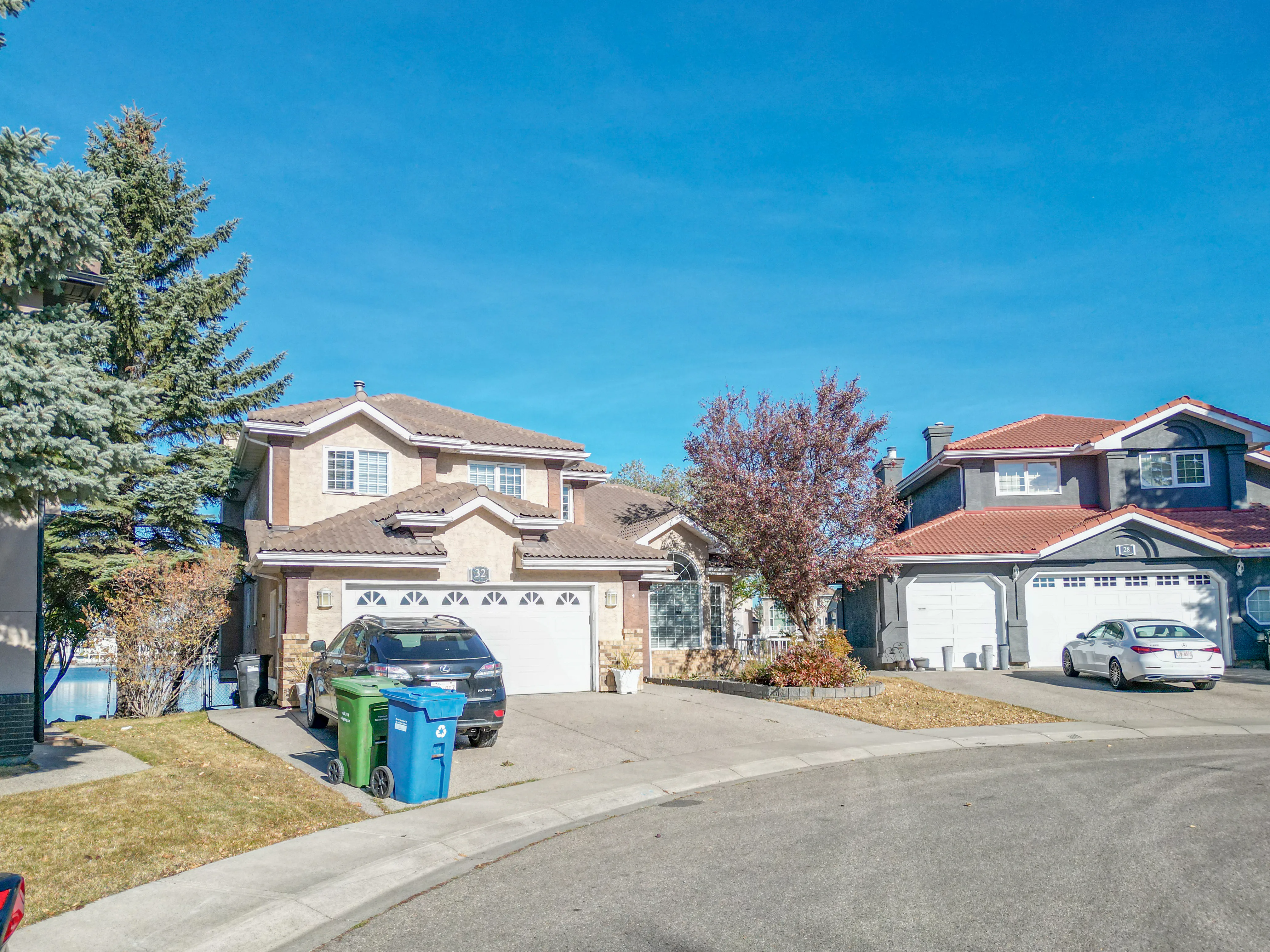Two-storey homes with double garages on a quiet residential street