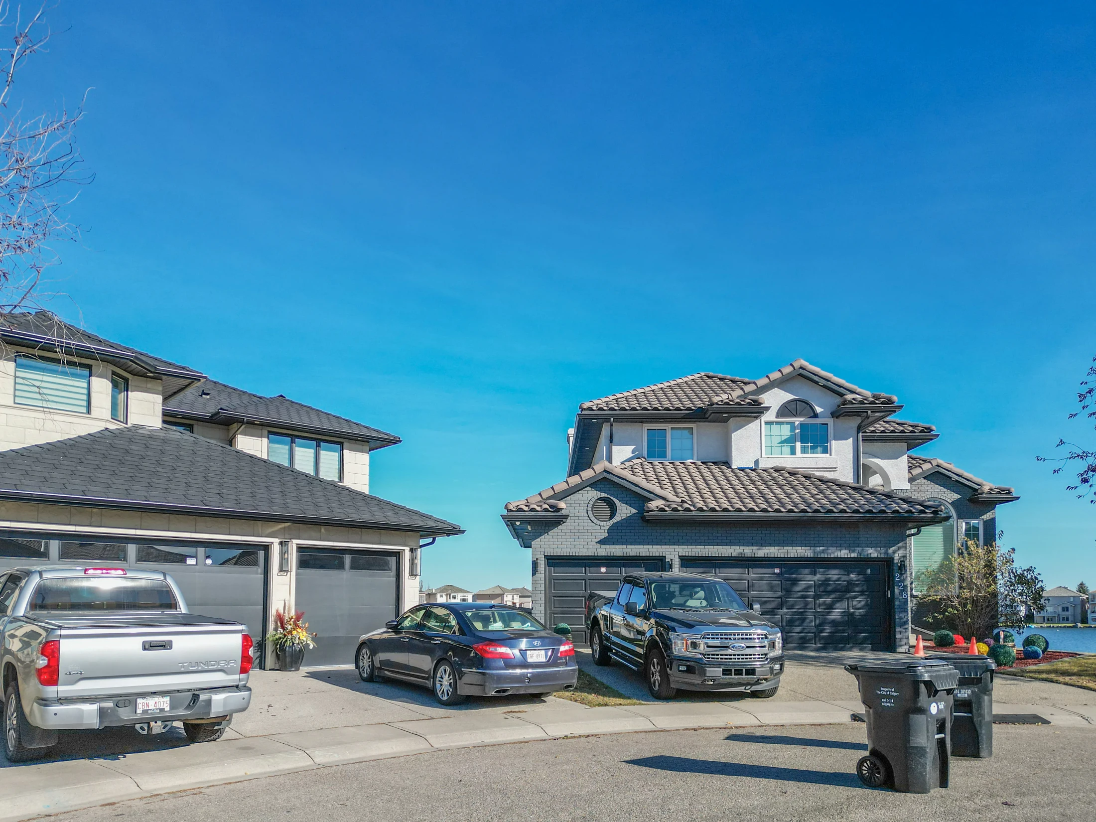 Two-storey homes with tile roofs and double garages