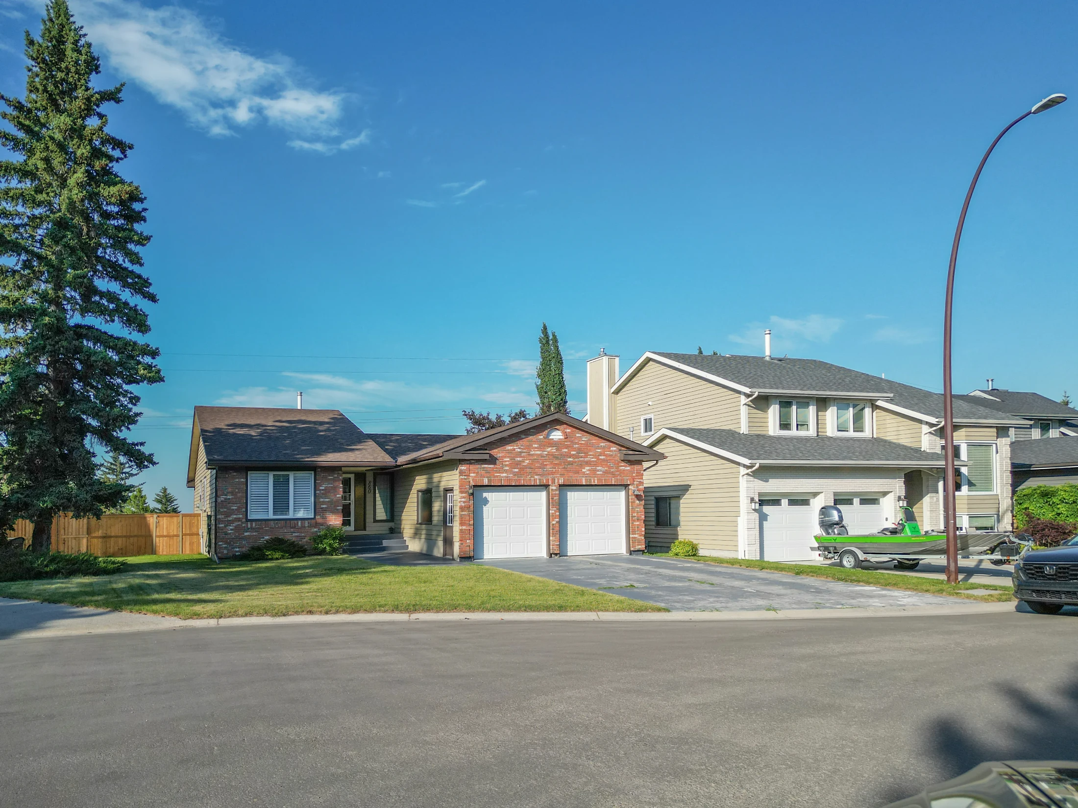 Split-level homes with attached garages on a quiet street