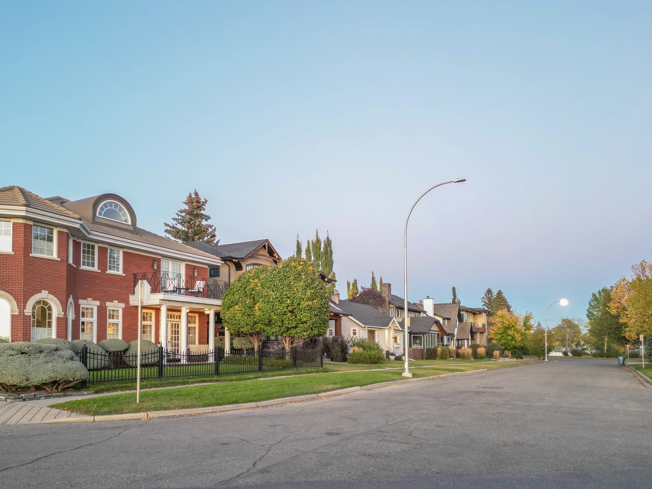 Brick character home on a quiet street with mature trees