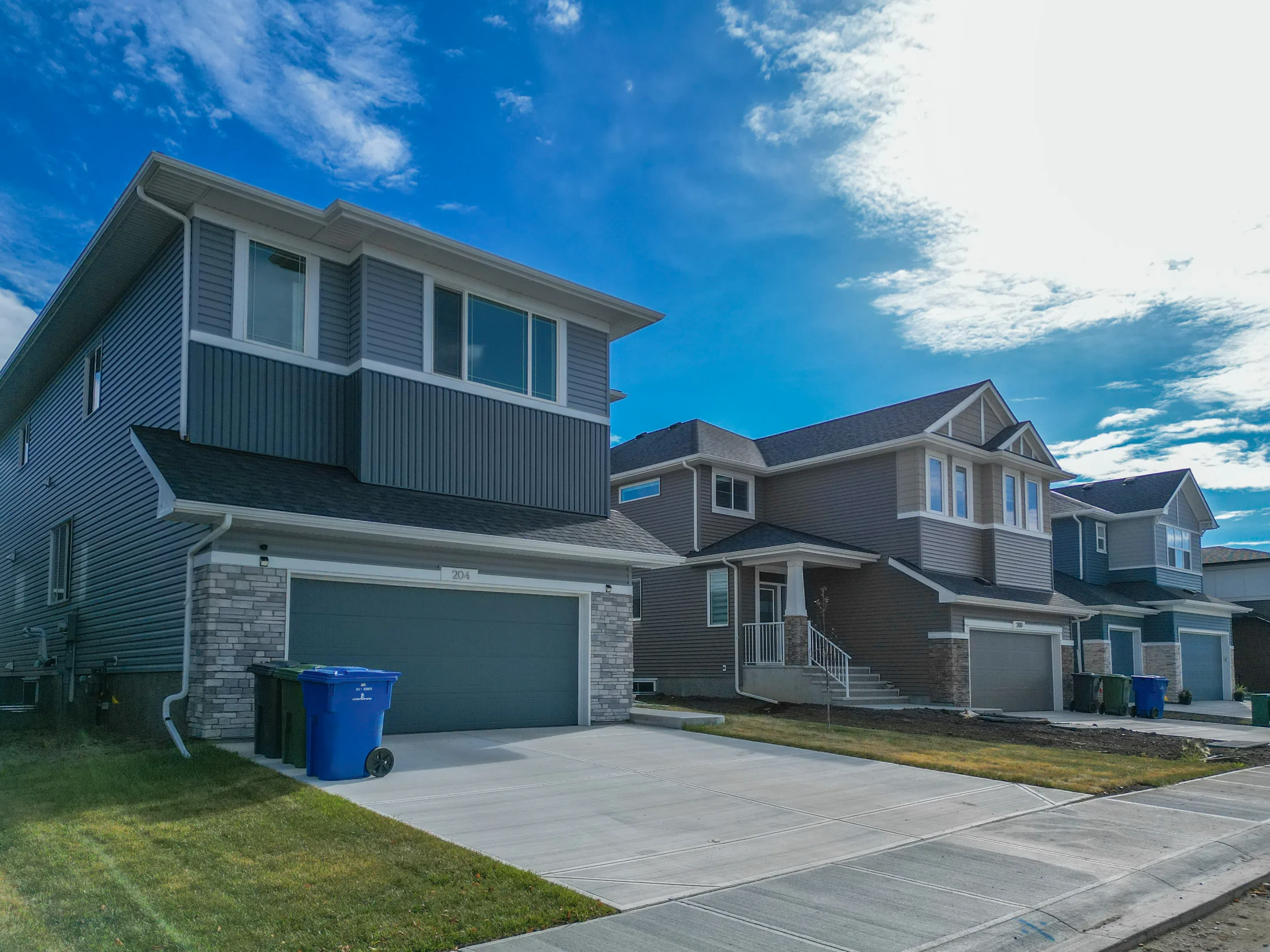 Two-storey homes with double front garages on a new suburban street