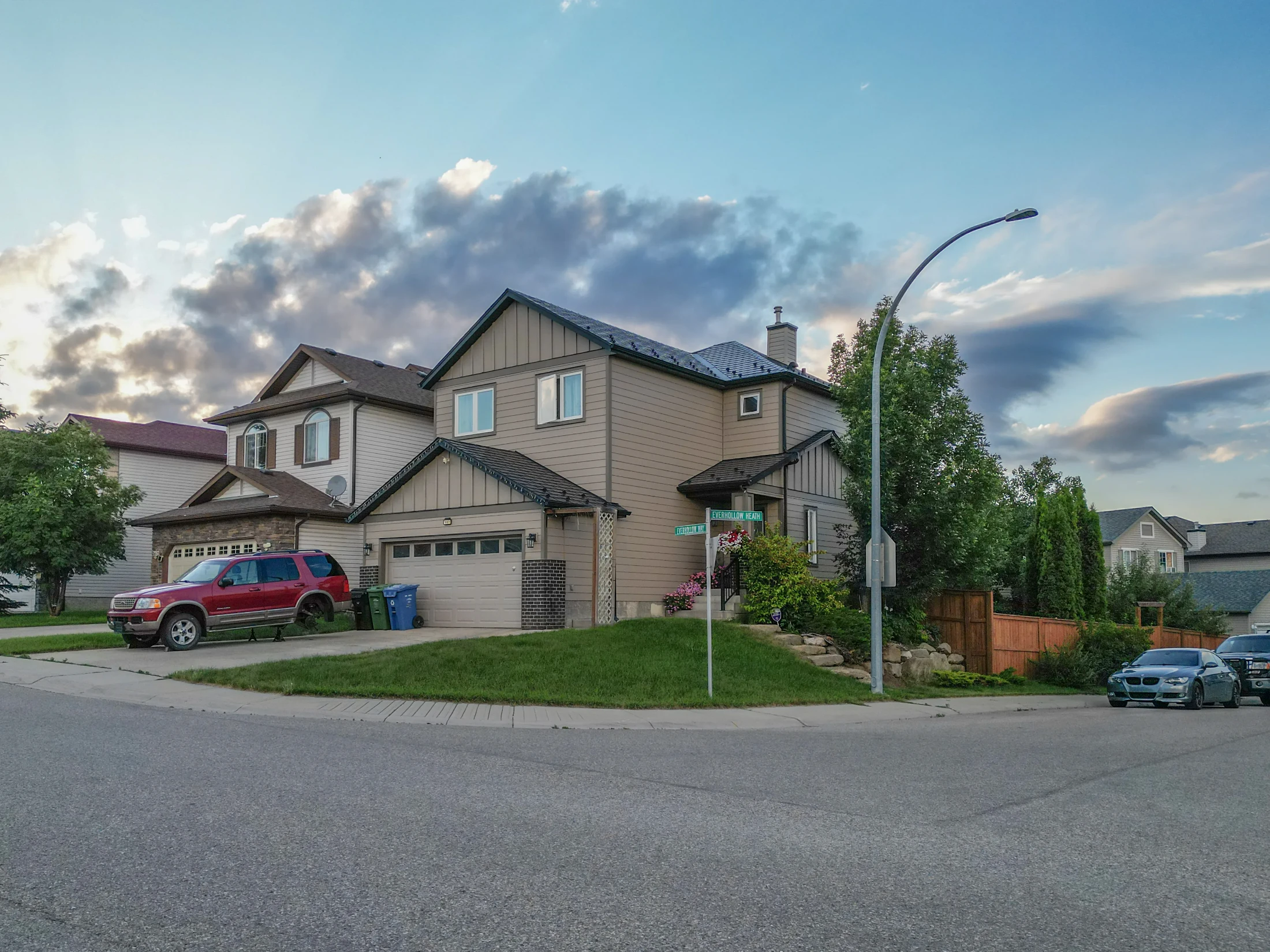 Two-storey homes with front garages along a quiet street