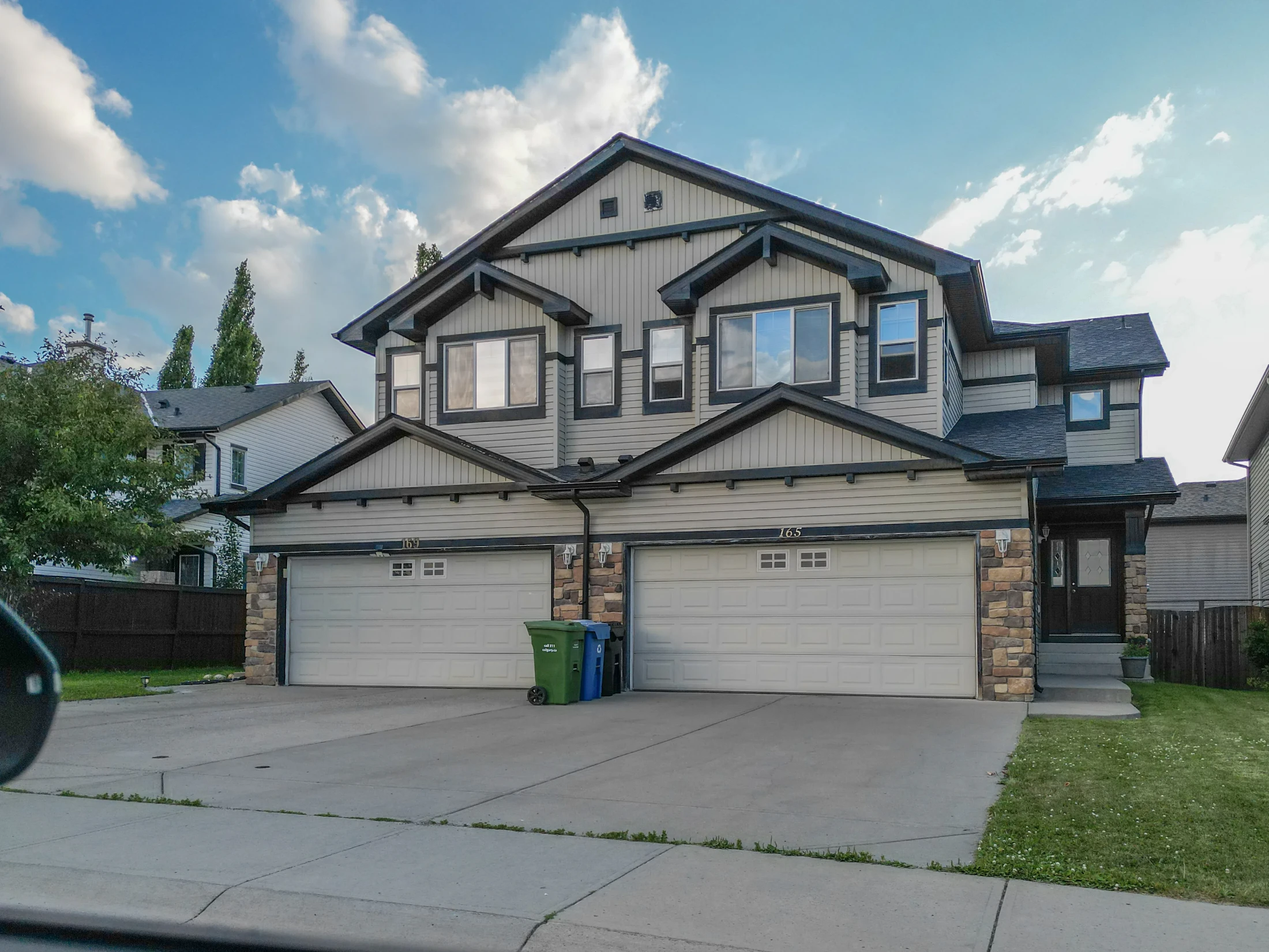 Two-storey homes with double front garages on a suburban street
