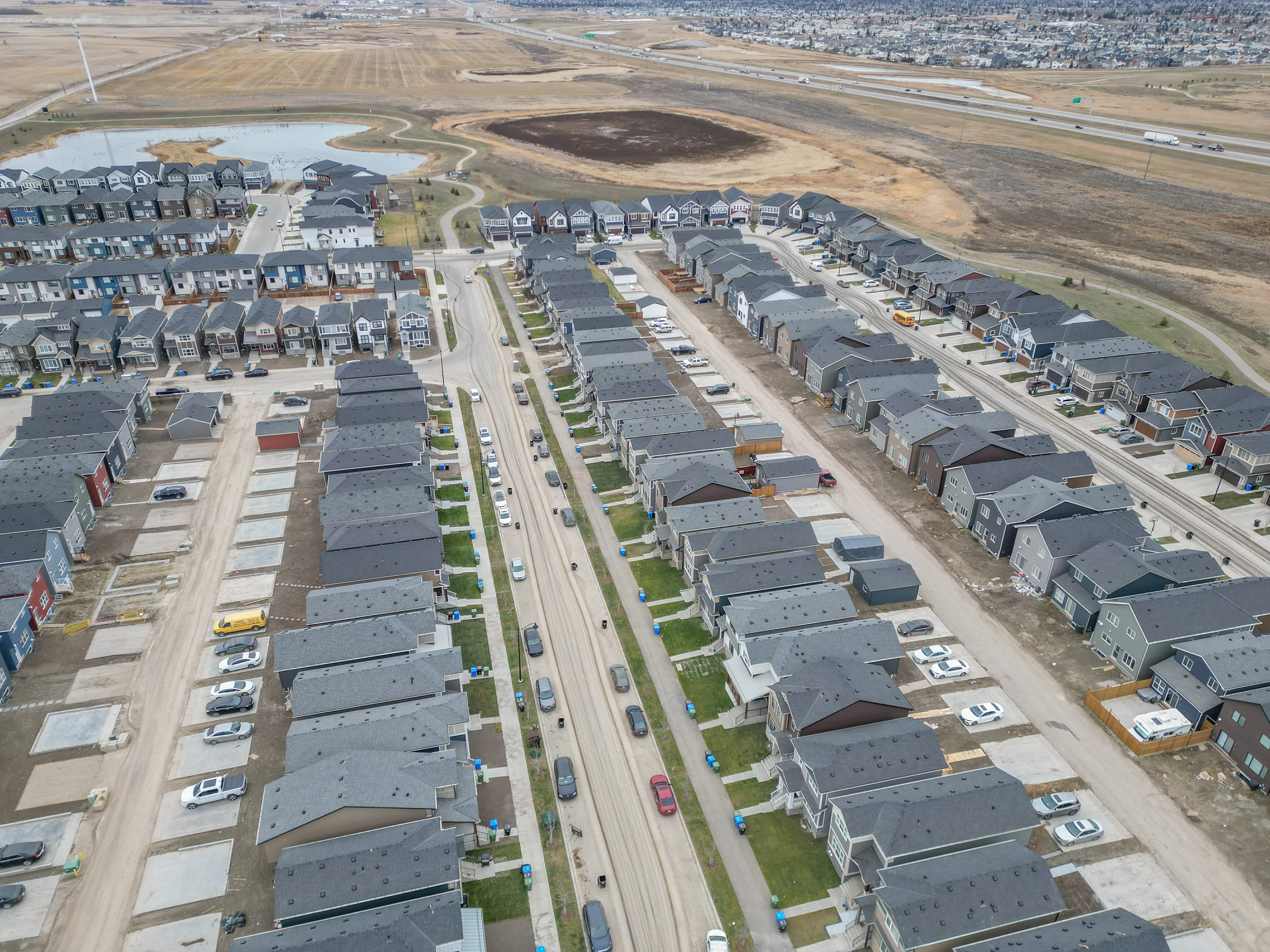 Aerial of rows of new laned homes with rear parking pads