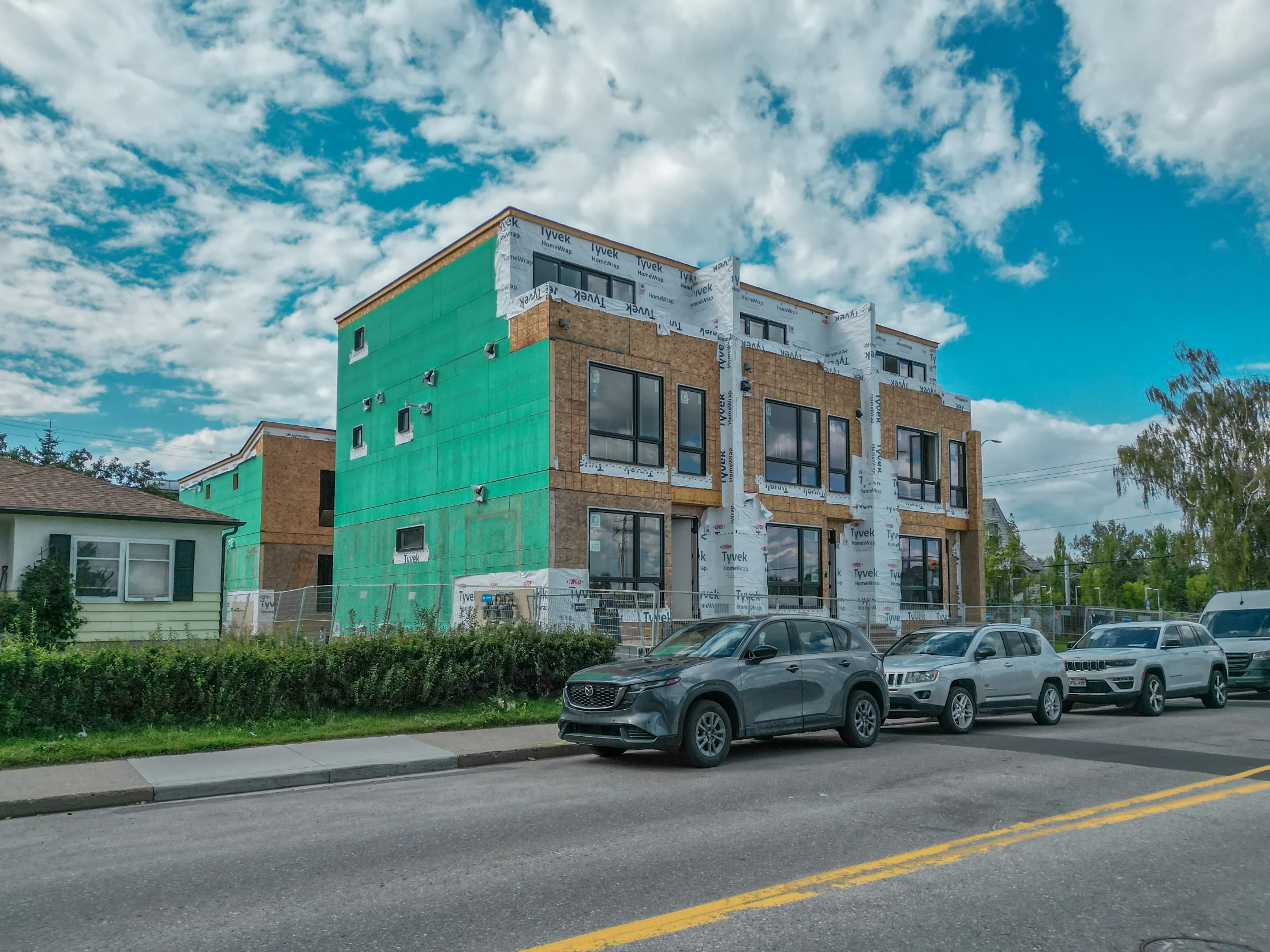 New infill under construction next to an older bungalow