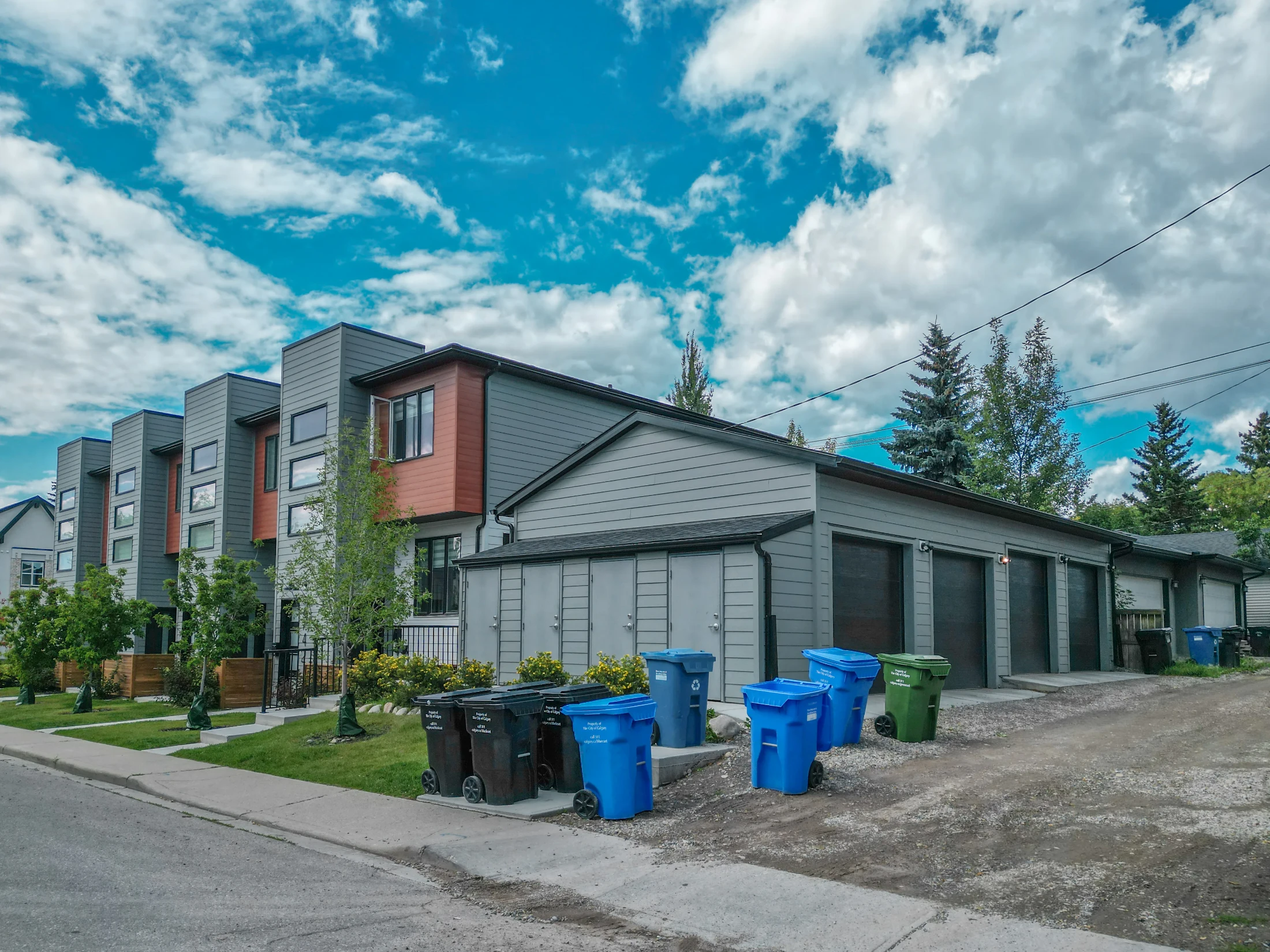 Row of modern infill townhomes with rear garages