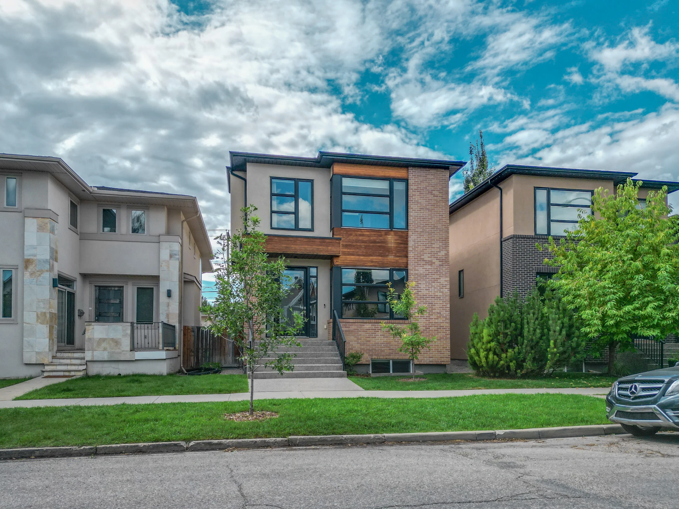 Two narrow modern infill homes on an inner-city street