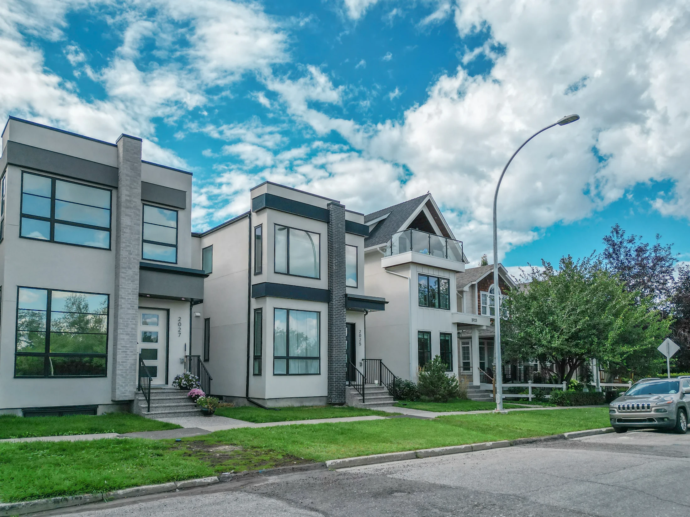 Row of modern narrow infill homes along an inner-city street