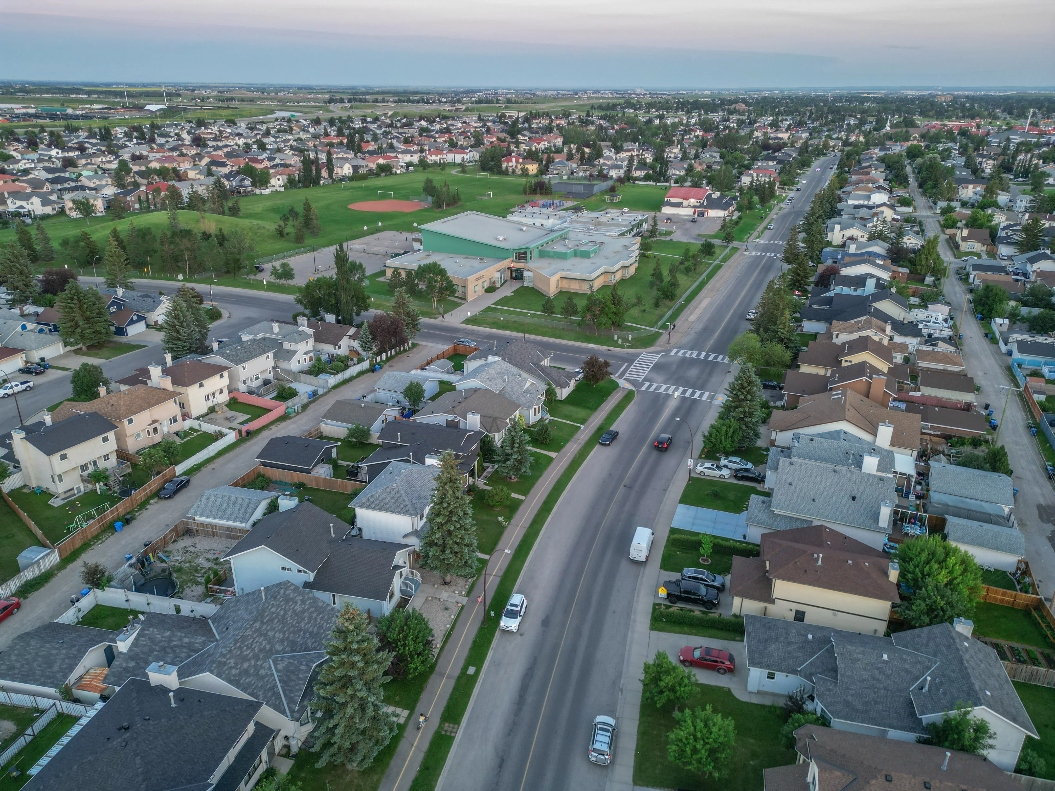 Aerial of homes beside a school field