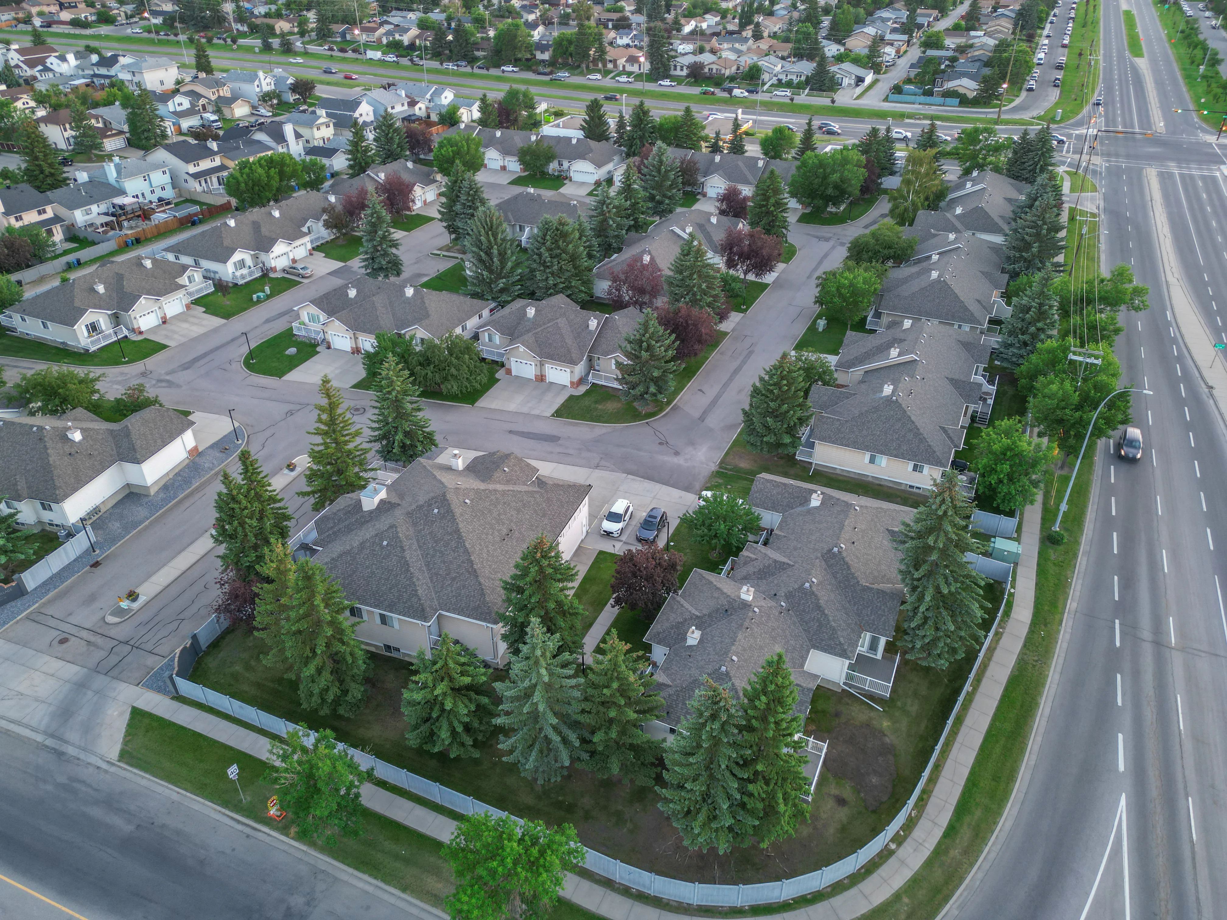 Aerial of a townhouse complex with trees