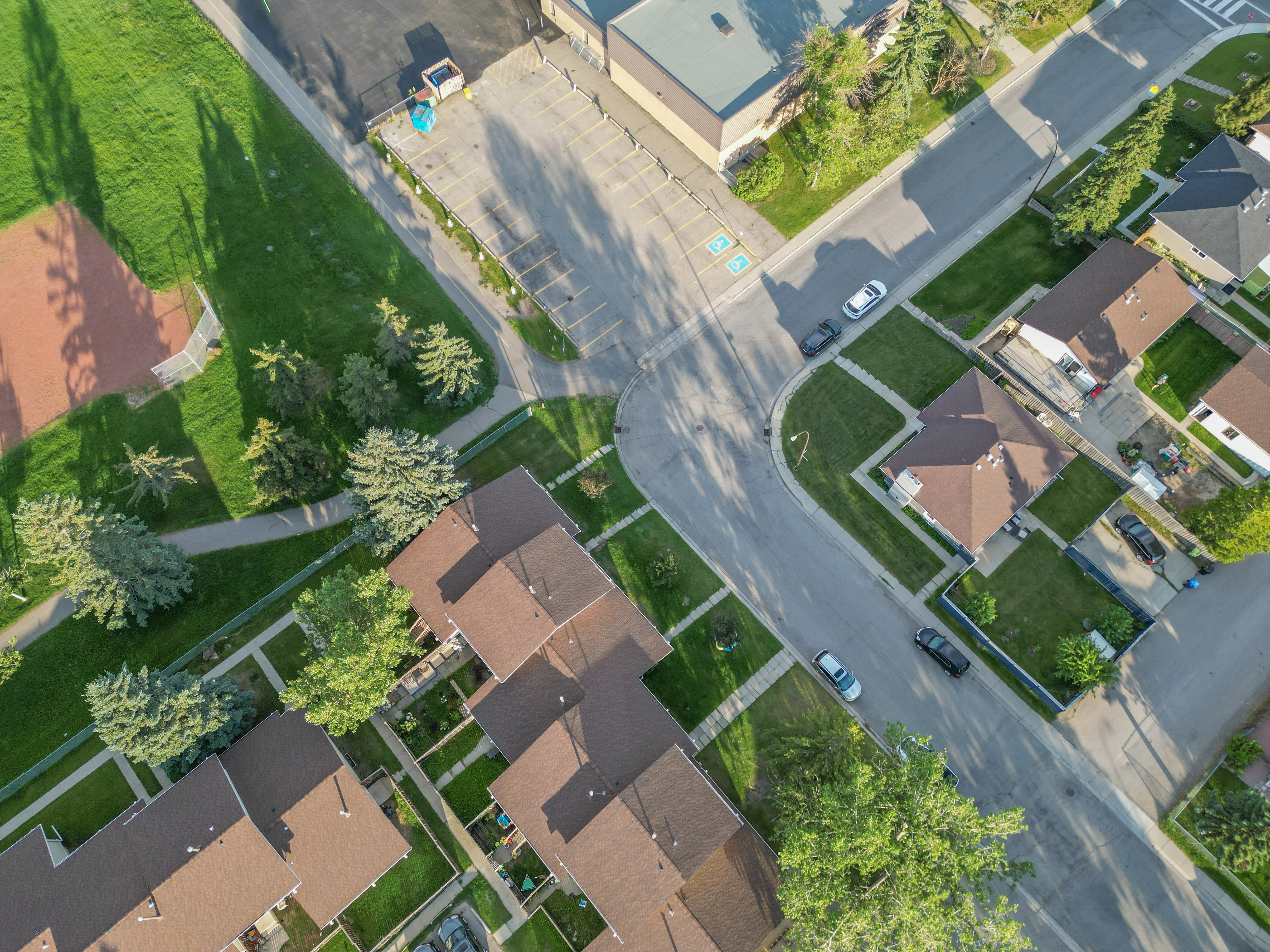 Aerial of homes and trees along a quiet street