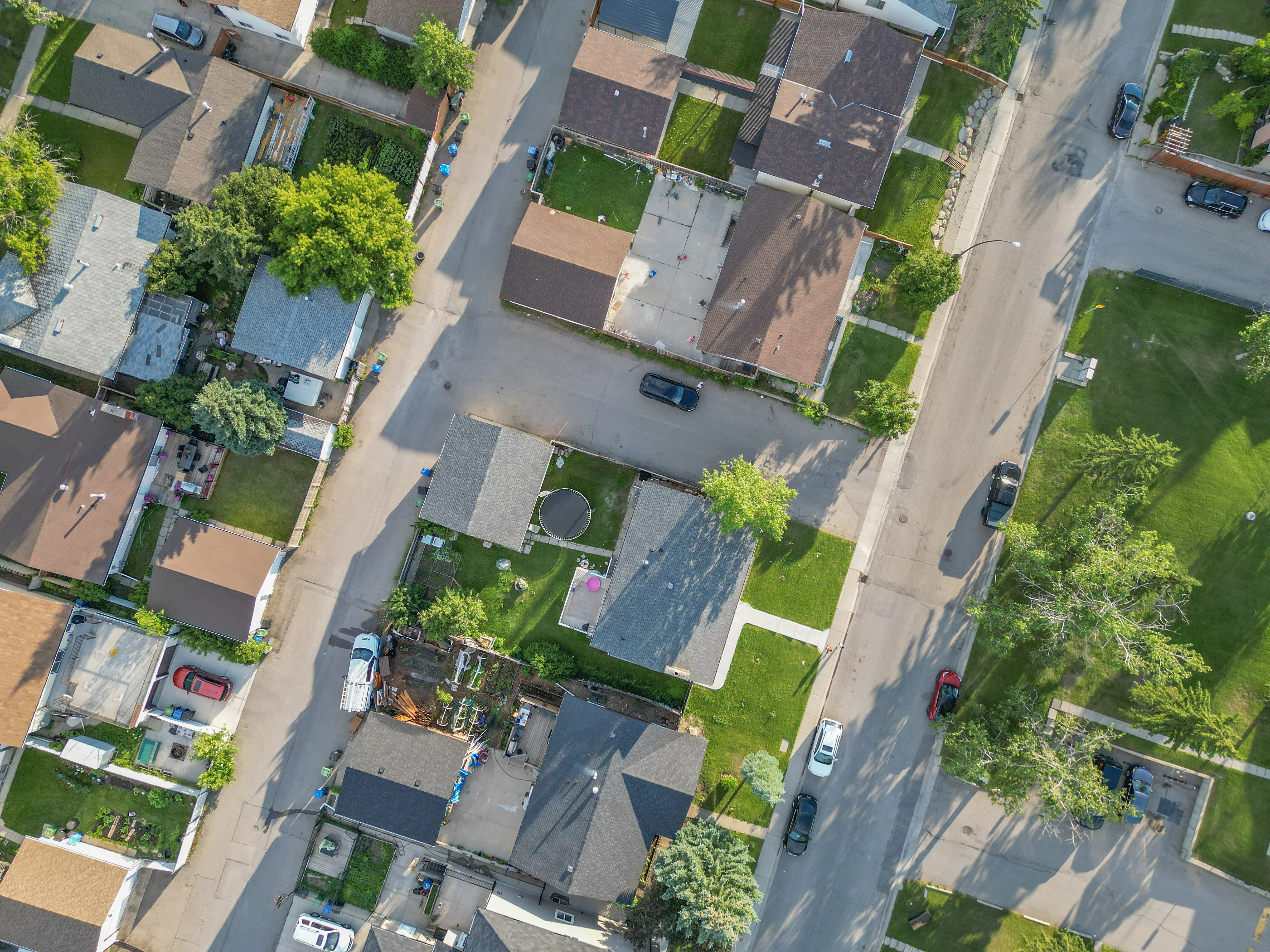 Aerial of homes and driveways along a residential street