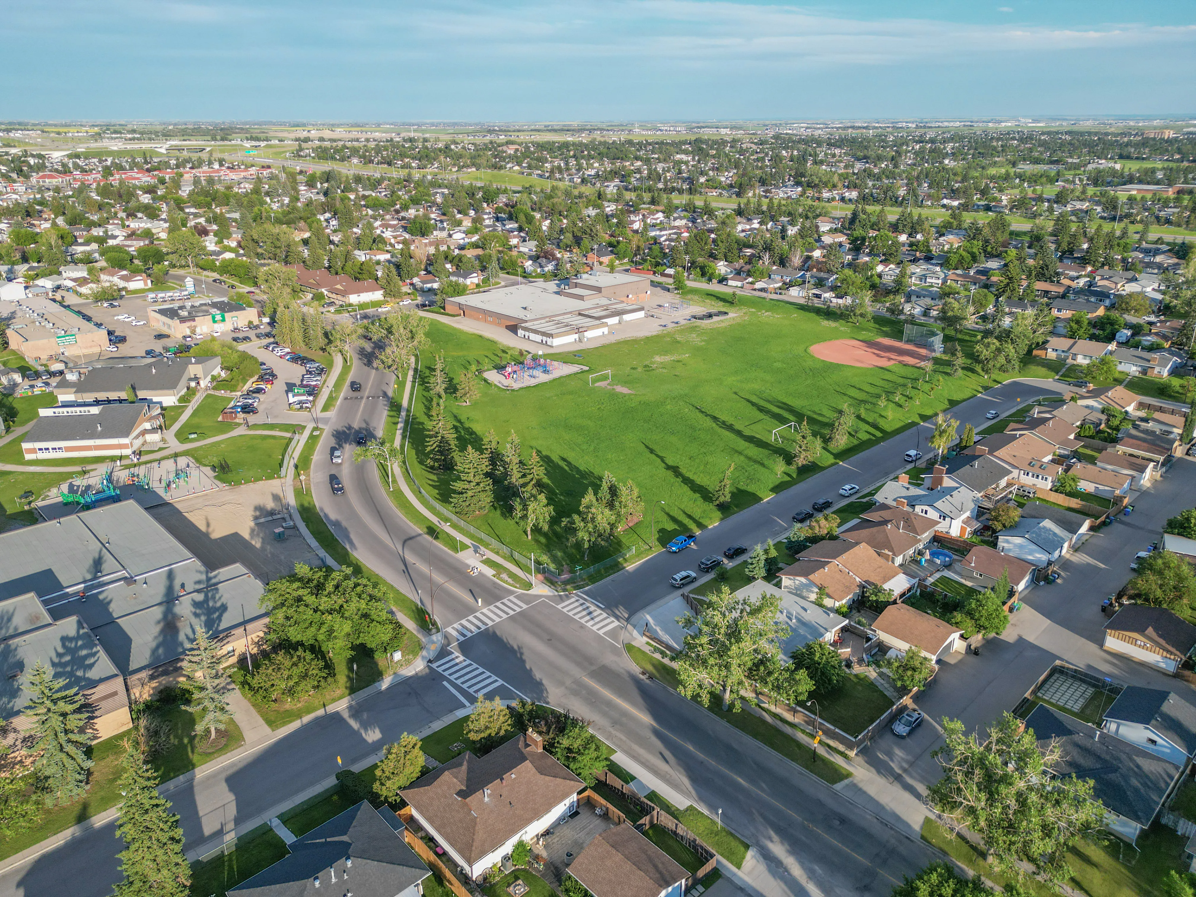 Aerial of a school, sports fields and nearby homes