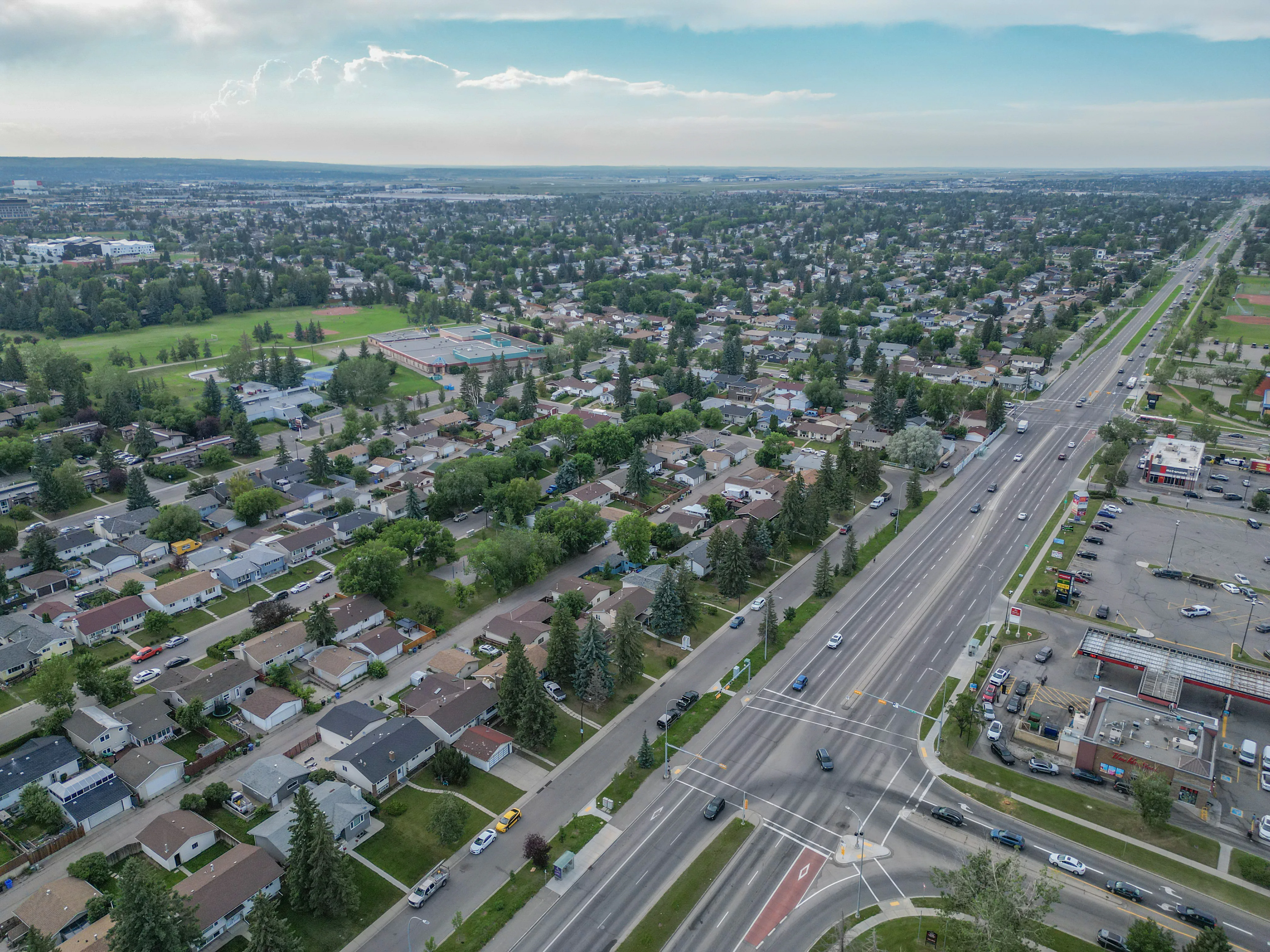 Aerial of detached homes along a main road