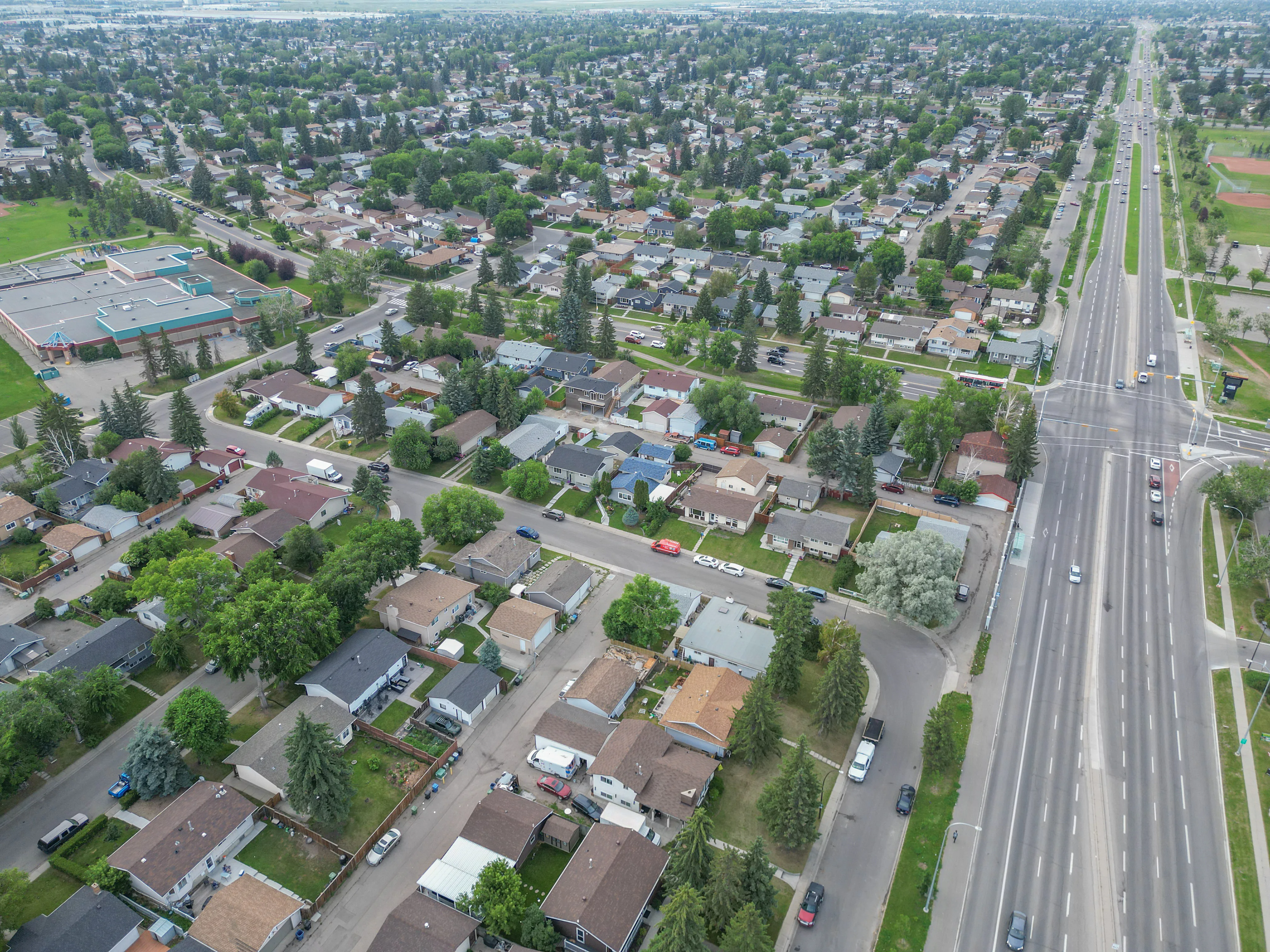 Aerial of homes beside a wide boulevard