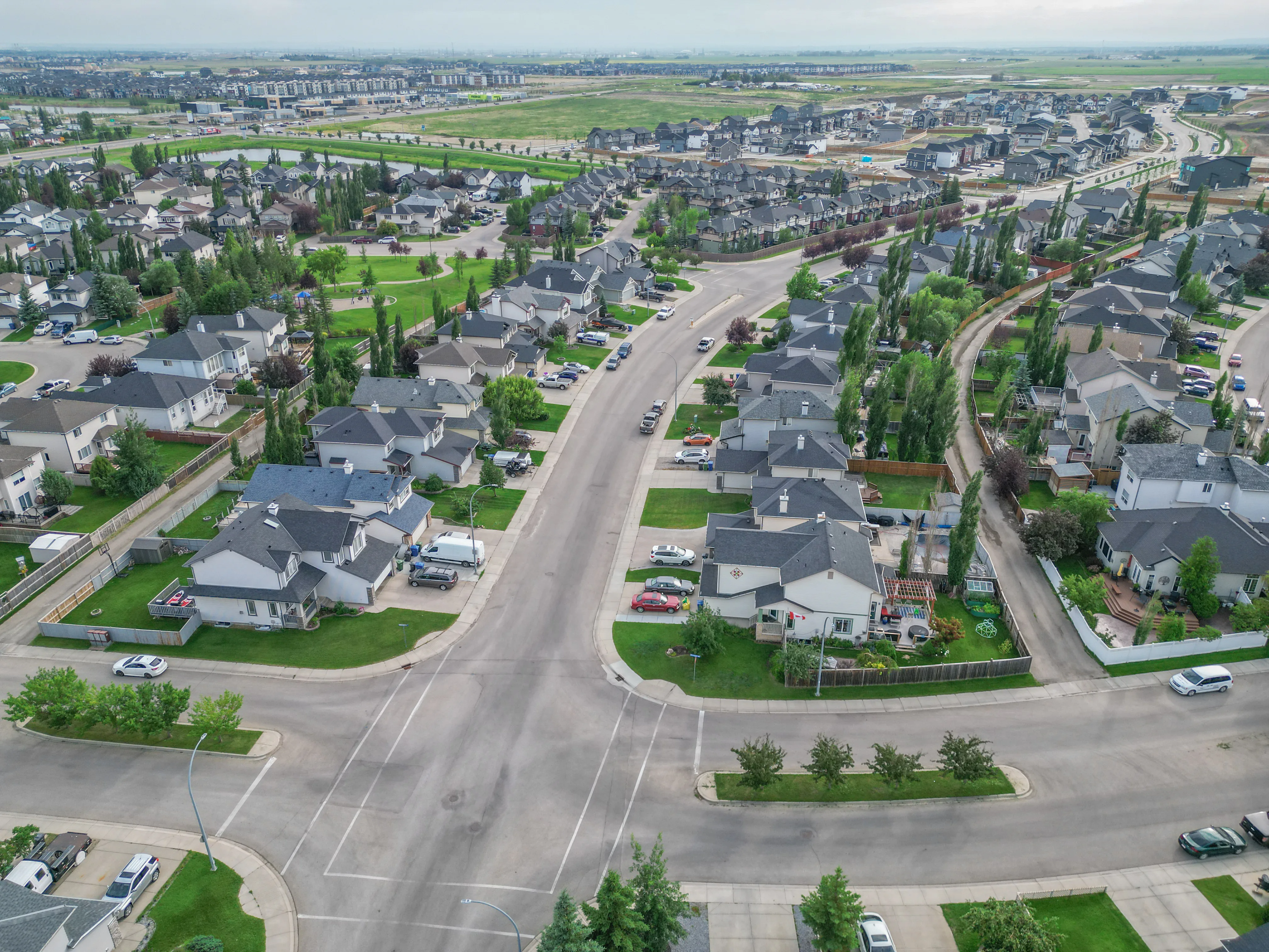 Aerial of two-storey homes along curving residential streets
