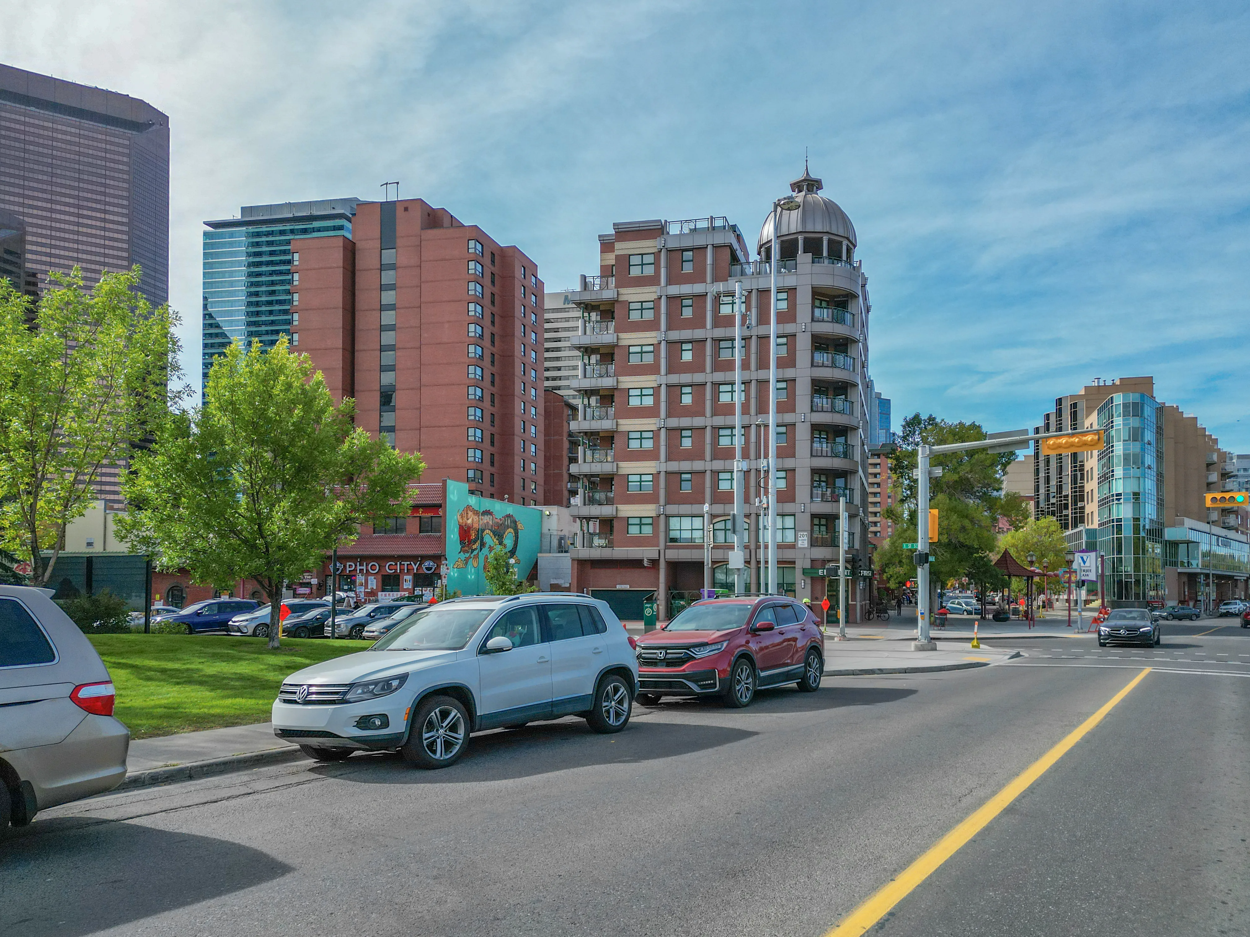 Mid-rise apartment buildings on a tree-lined street
