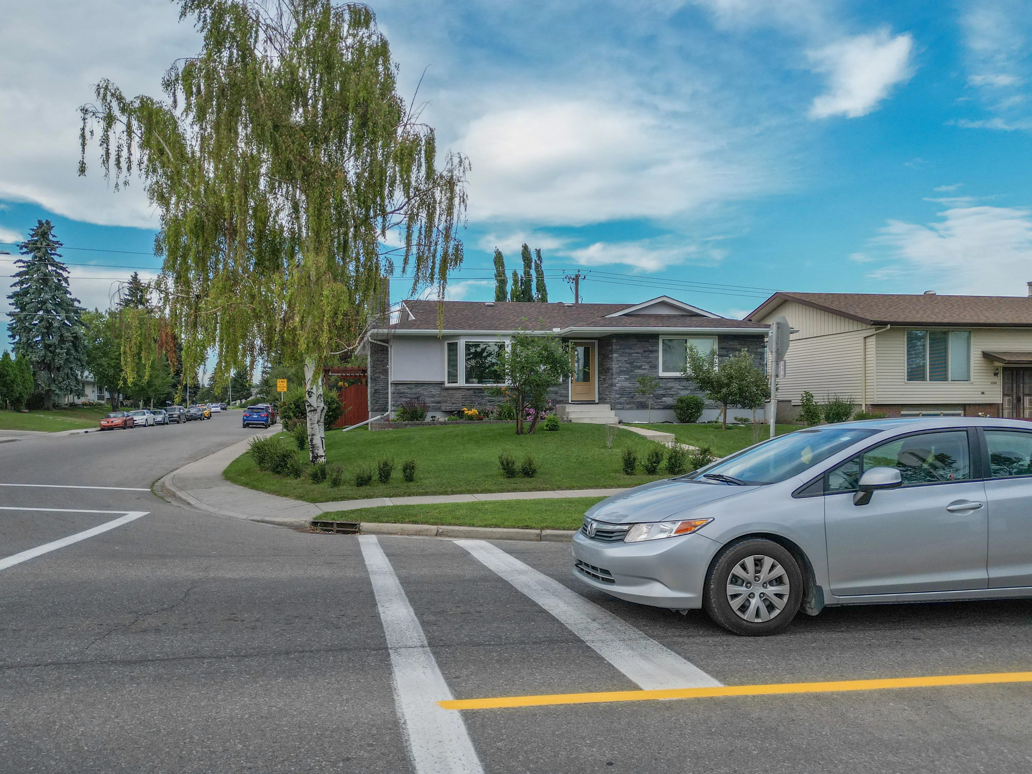 Bungalows with front lawns along a residential street