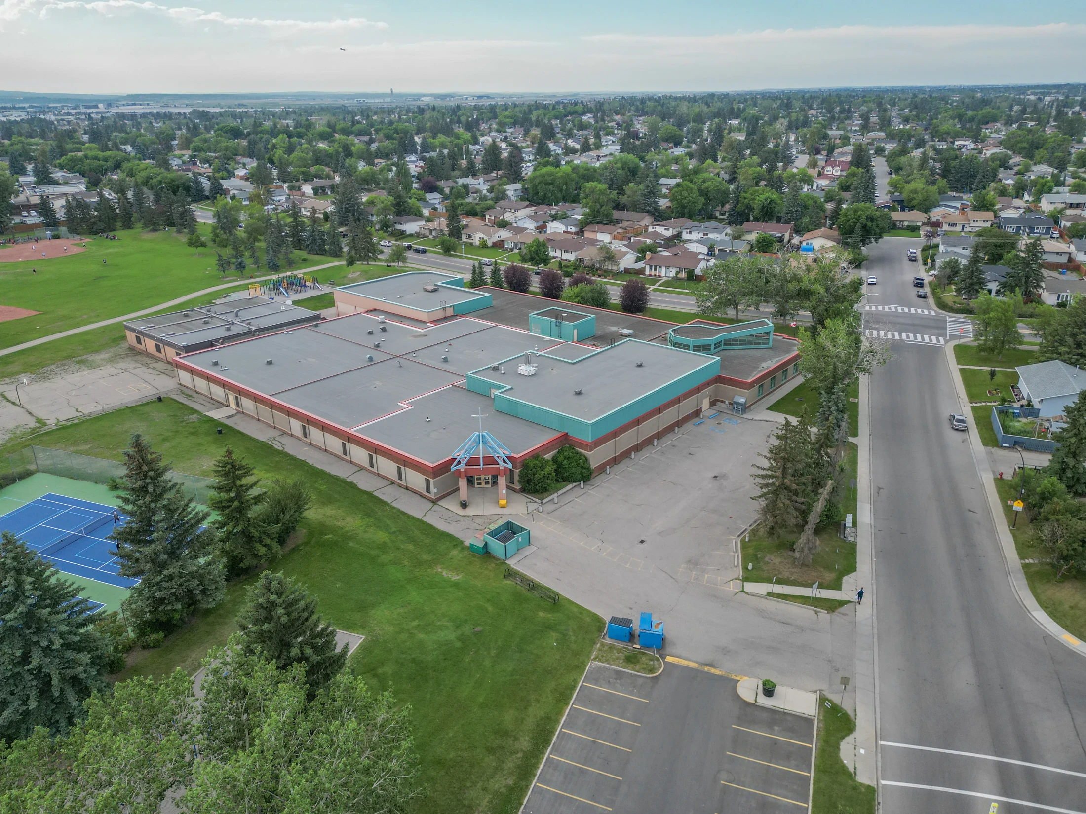 Aerial of a school building with a sports field