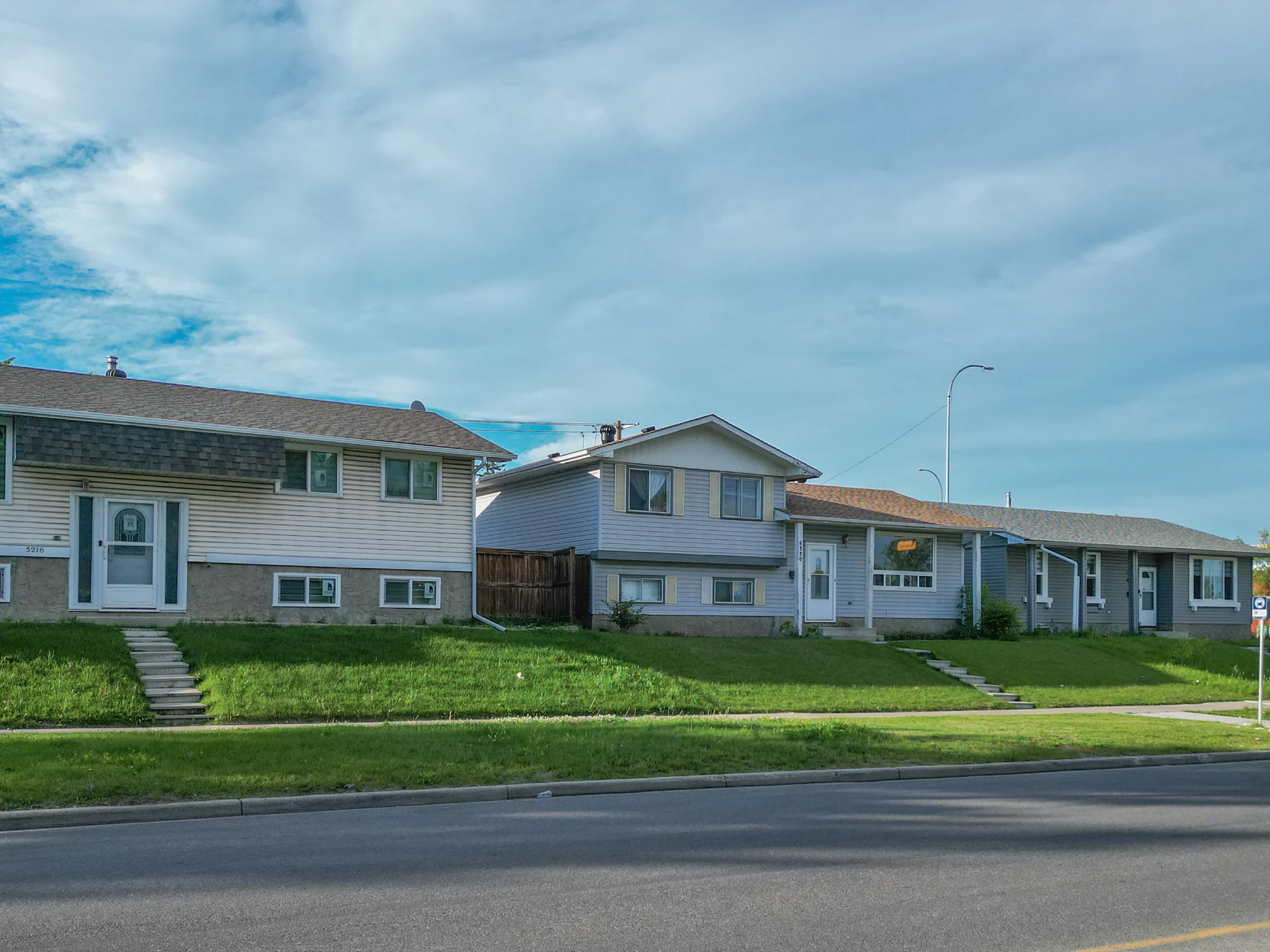 Split-level and bungalow homes along a residential street