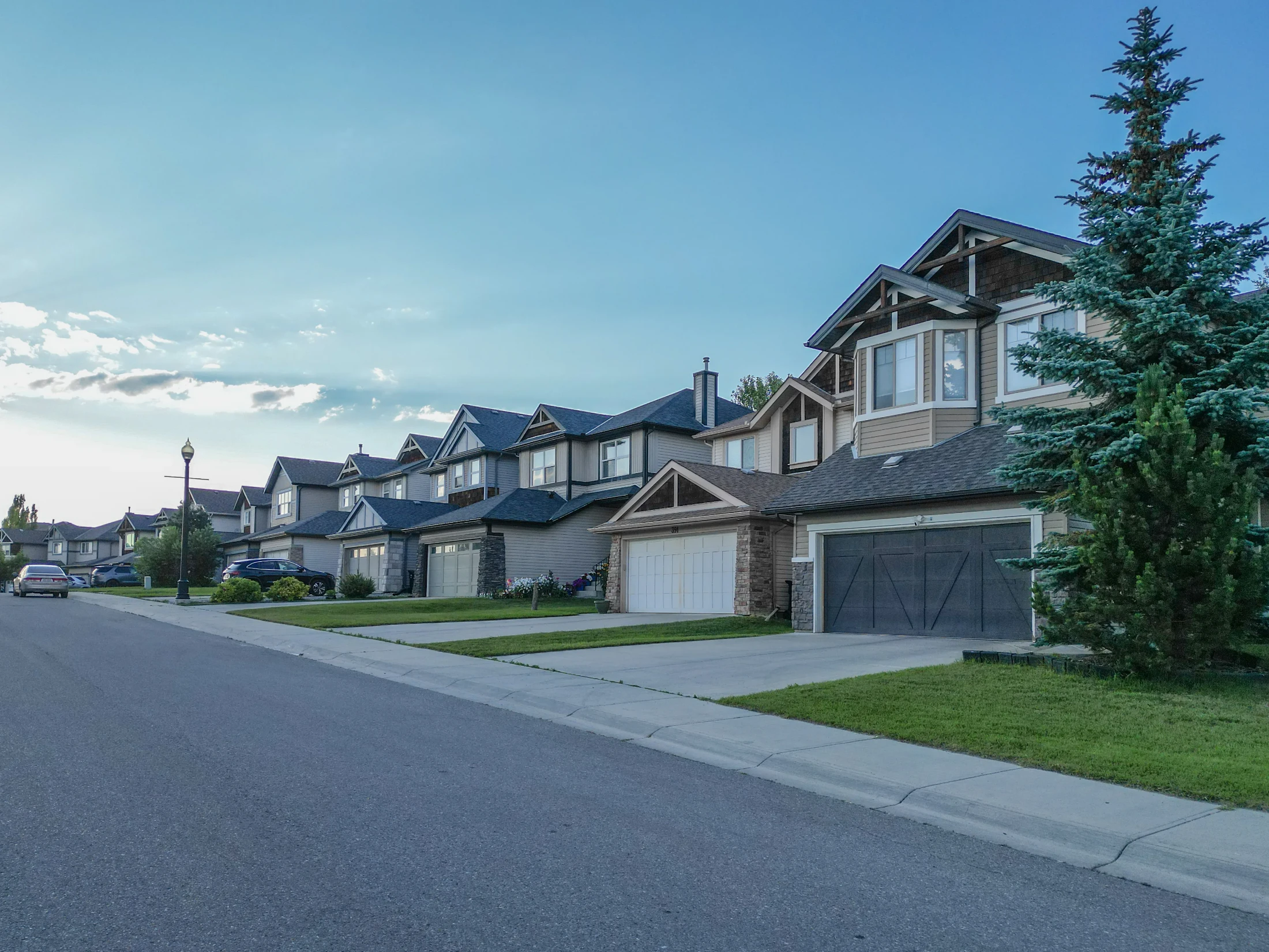 Two-storey homes with stone accents and double garages