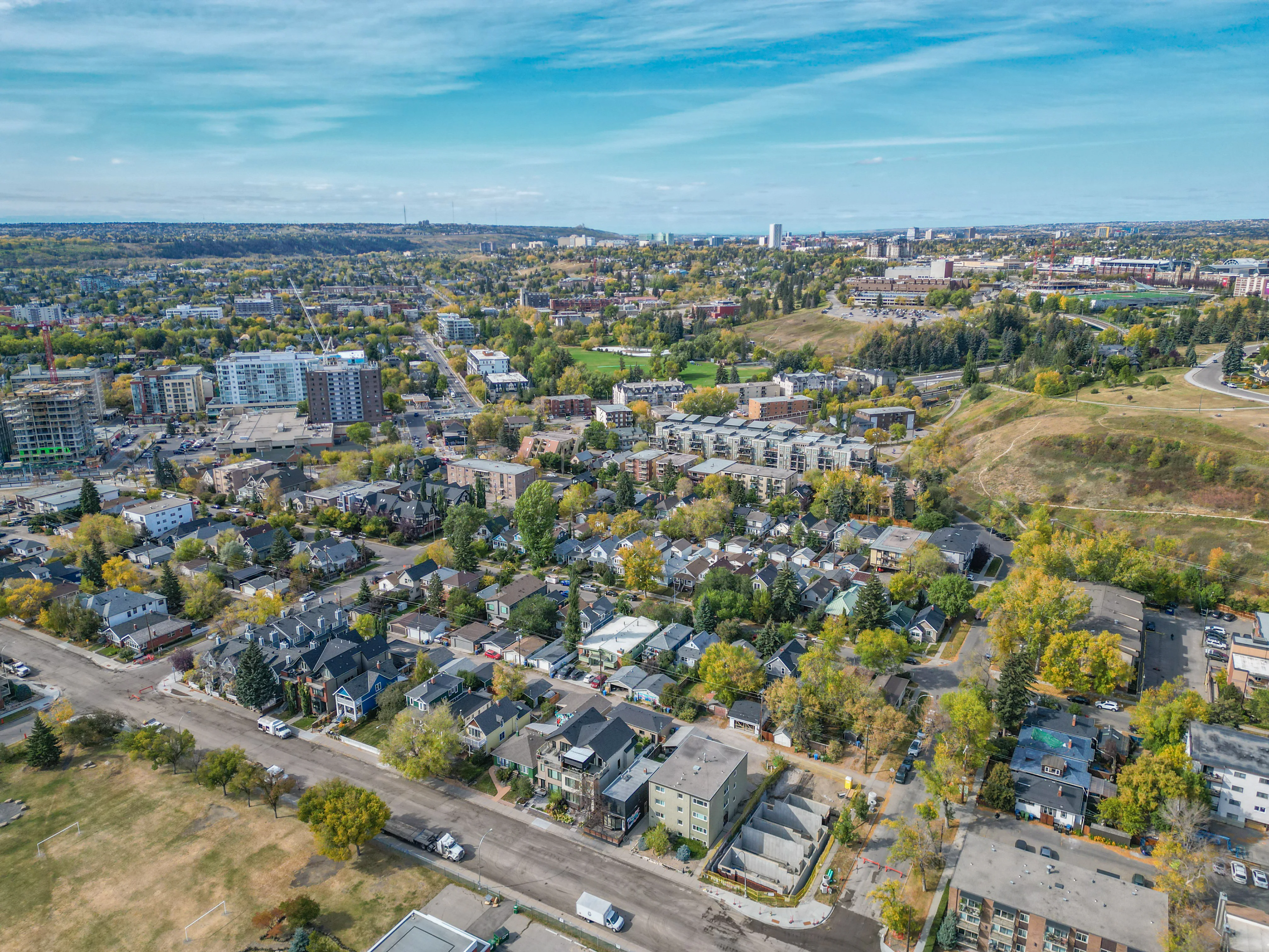Aerial of tree-lined streets and homes in Sunnyside, Calgary