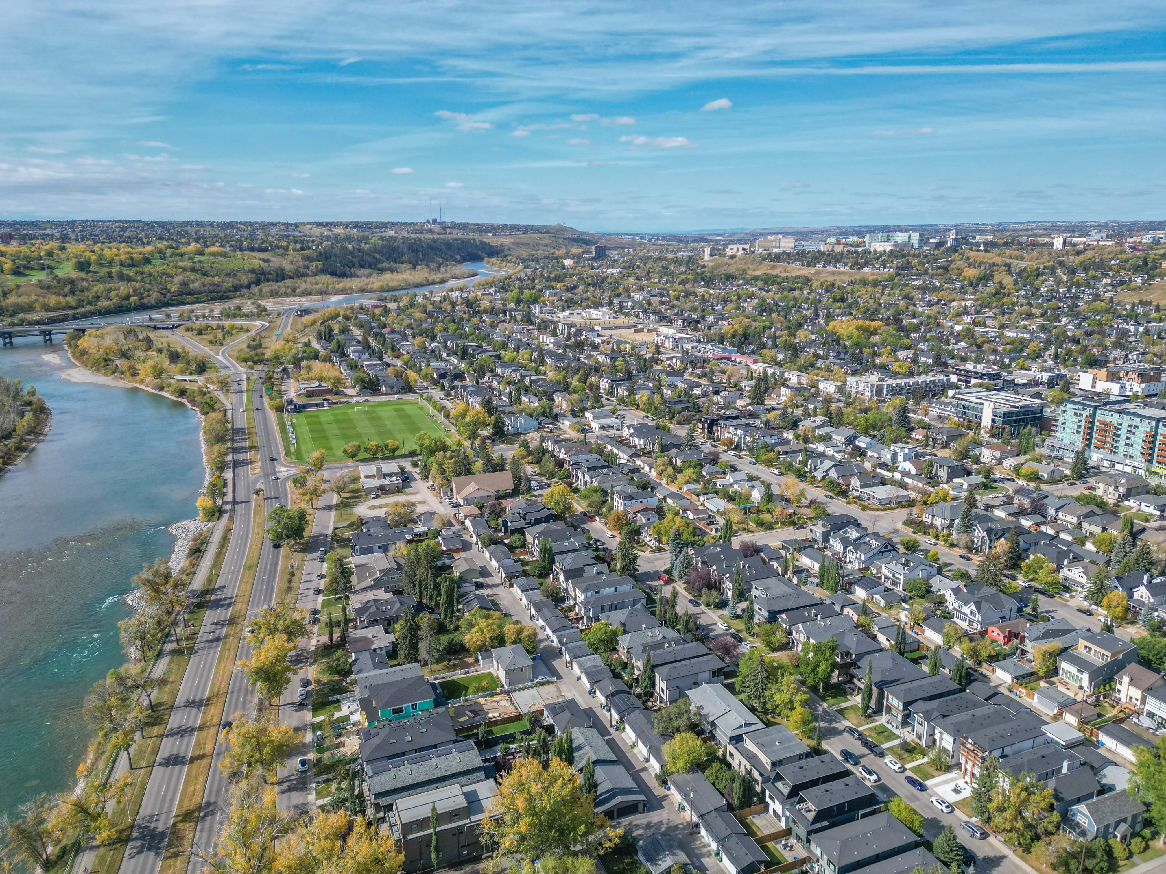 Aerial of a river curving past an inner-city neighbourhood