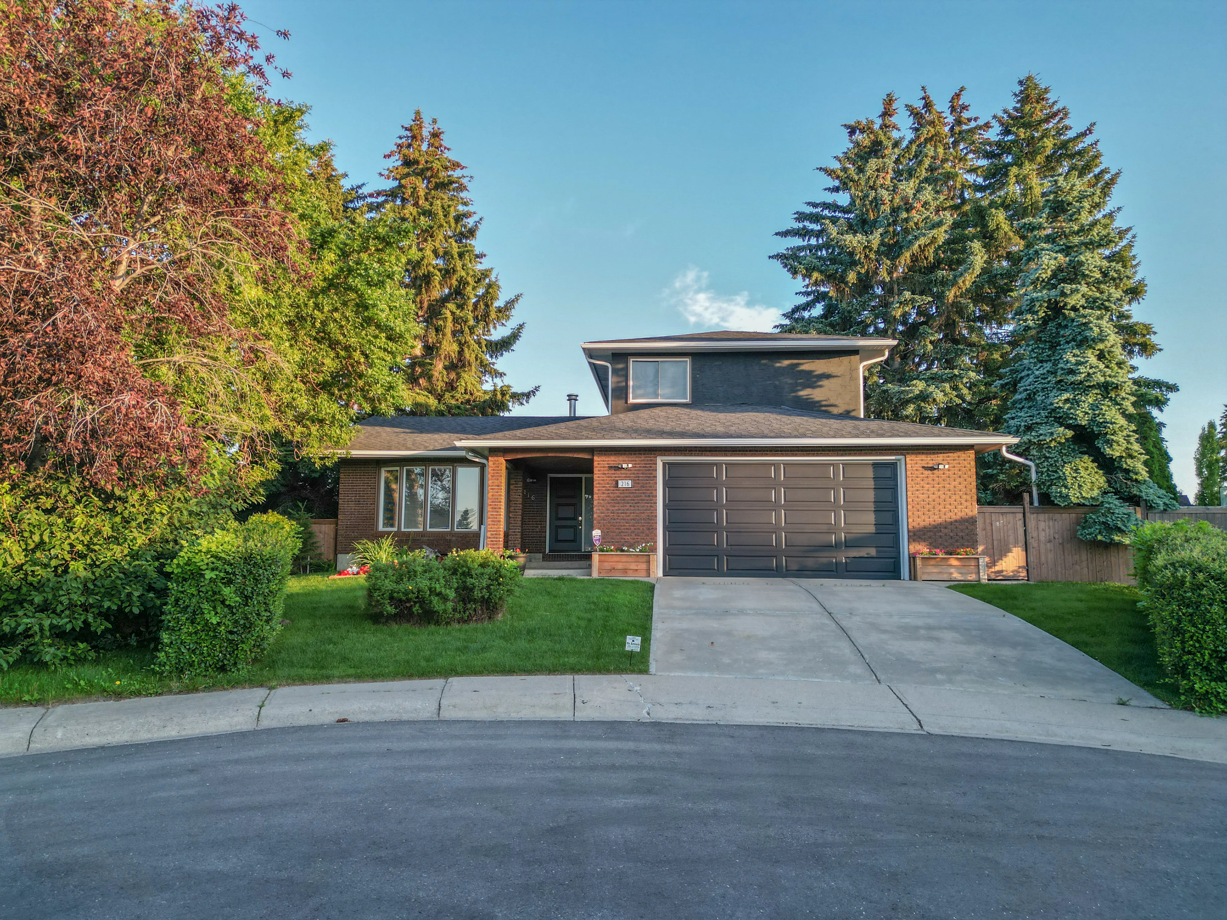 Updated bungalow with a front yard on a tree-lined street